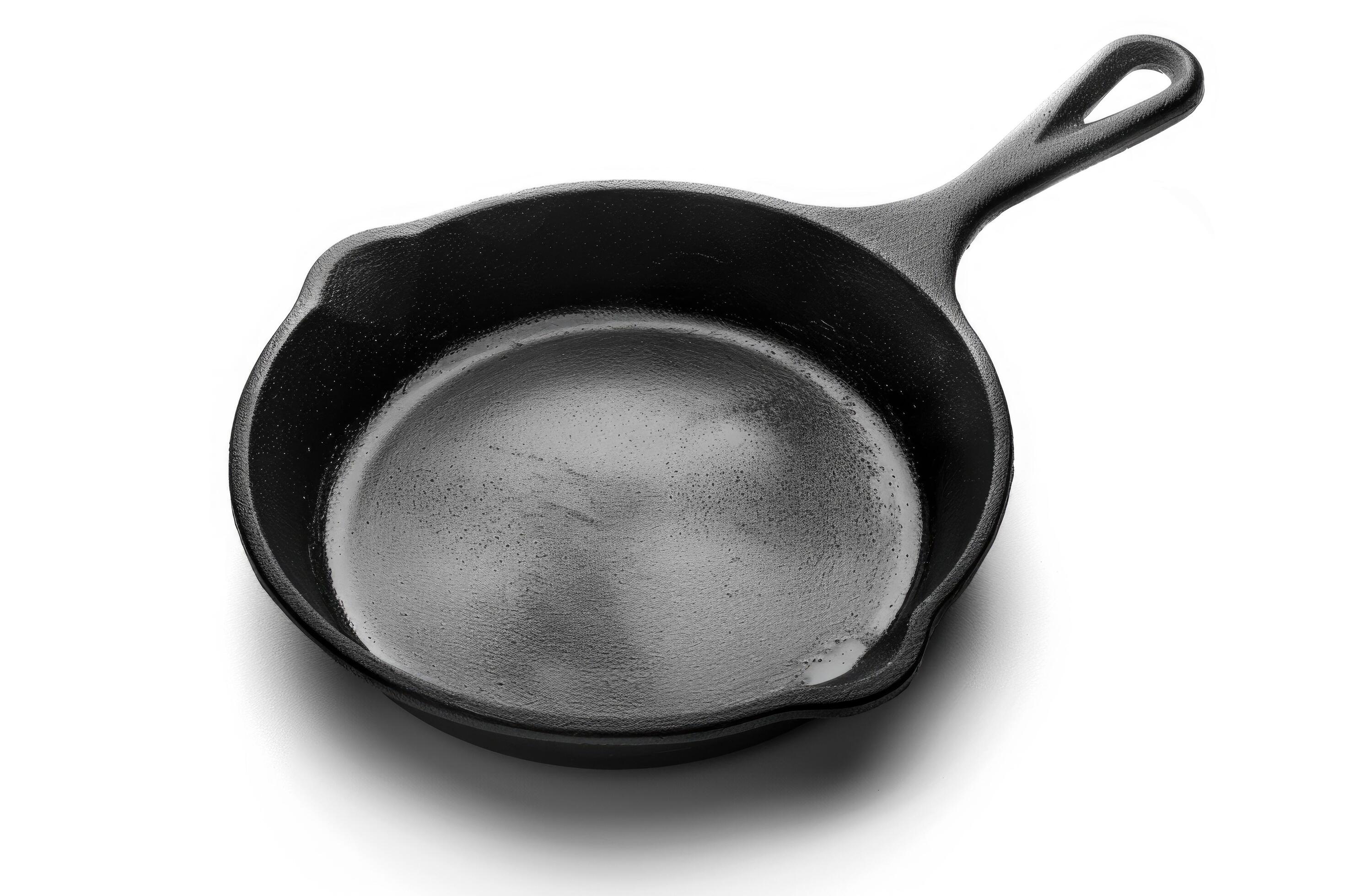 
									Black cast iron skillet on a white background. Stock Free