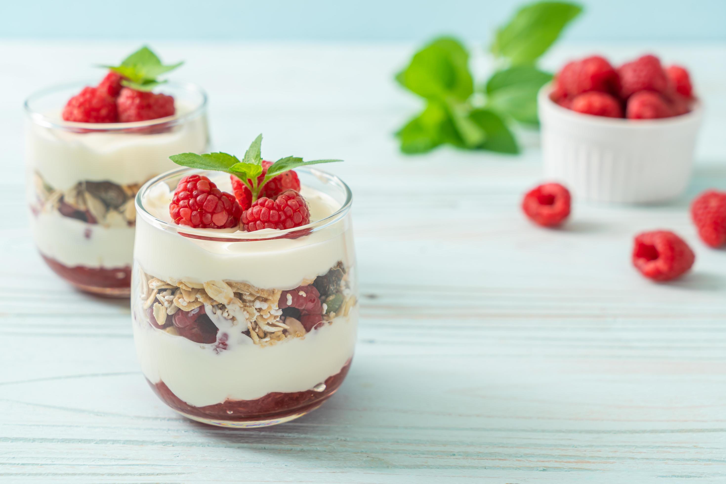 Fresh raspberry and yogurt with granola – Healthy food style Stock Free