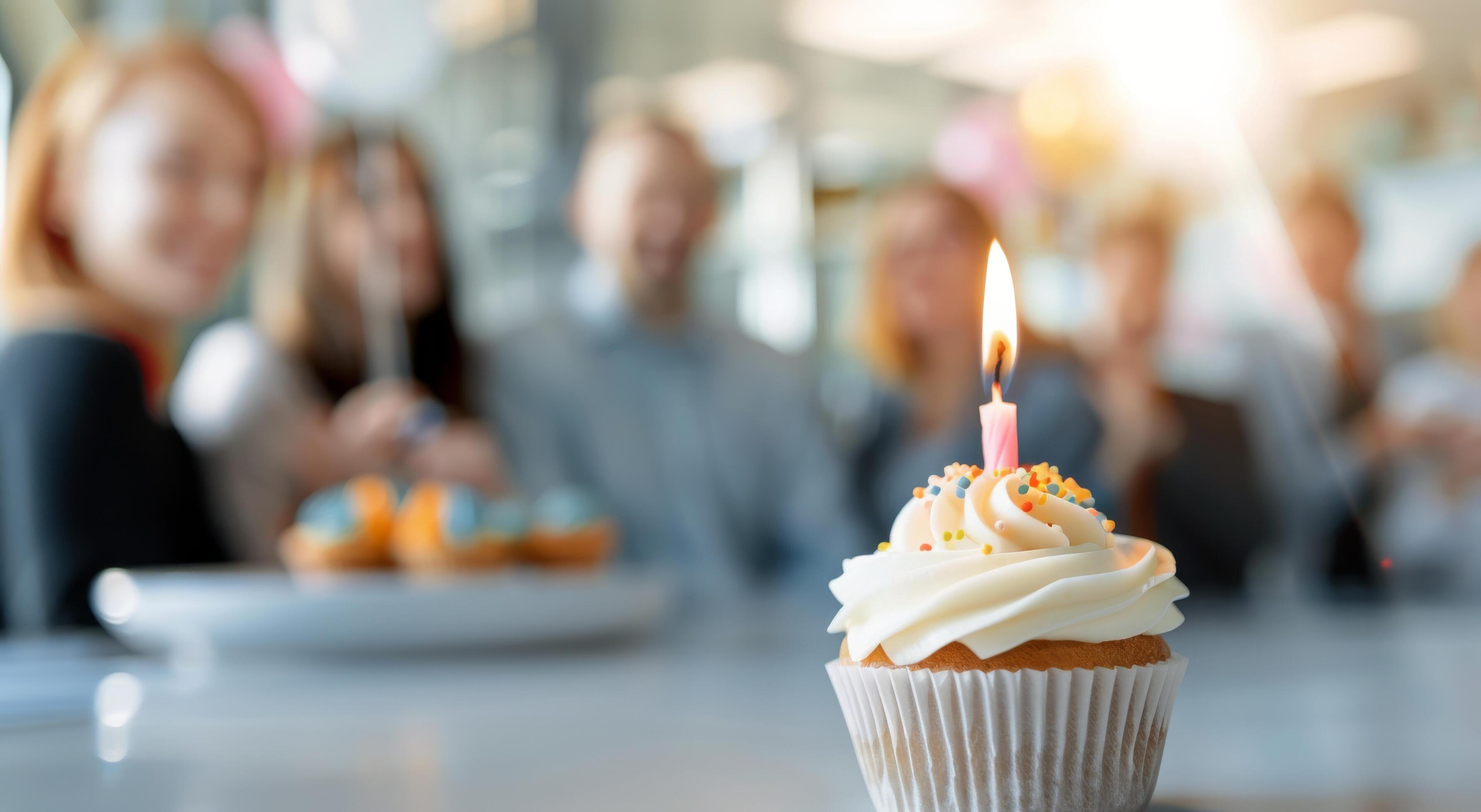 
									Birthday Cupcake With Colleagues in Background Stock Free