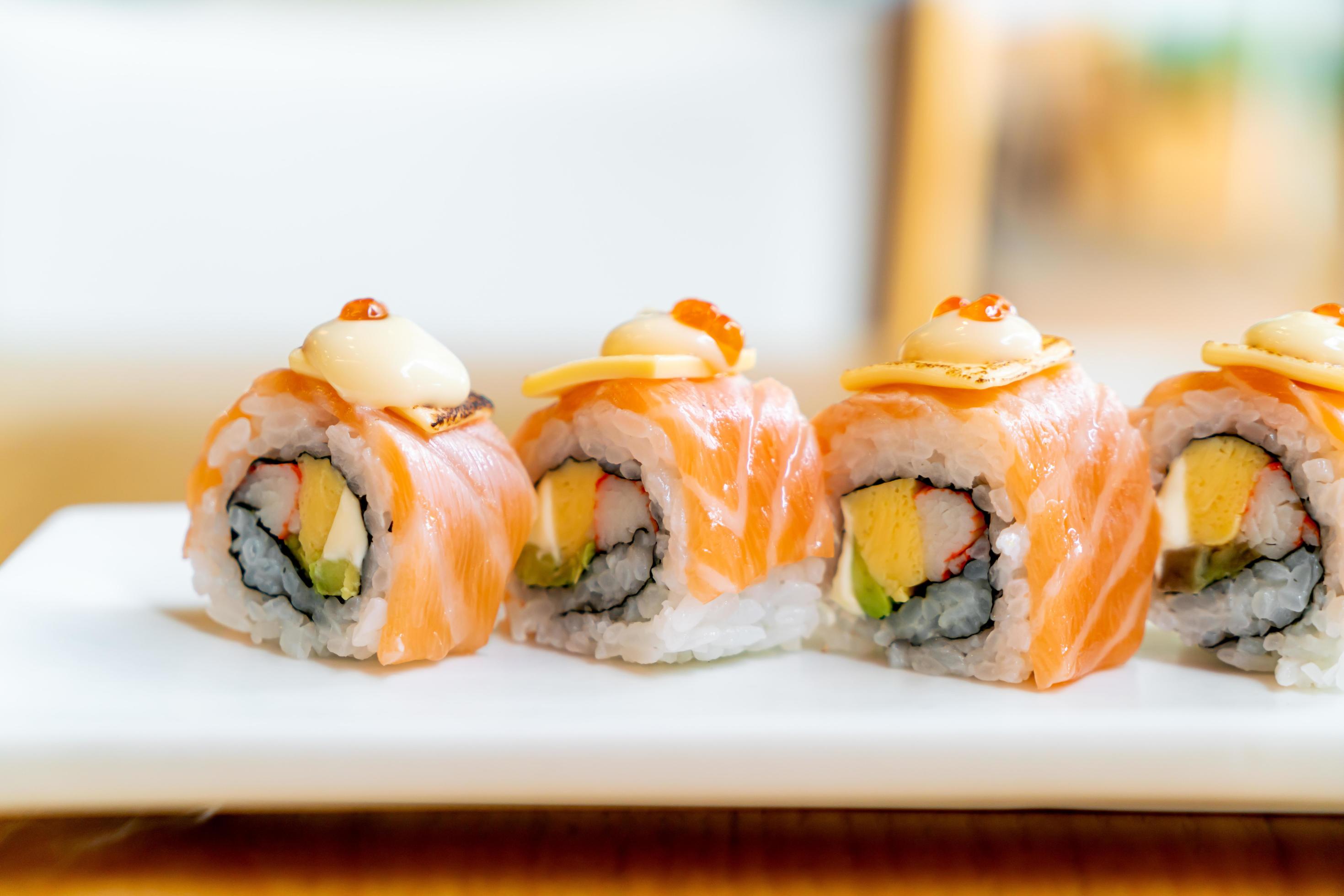 Salmon roll sushi with cheese on top – Japanese food style Stock Free