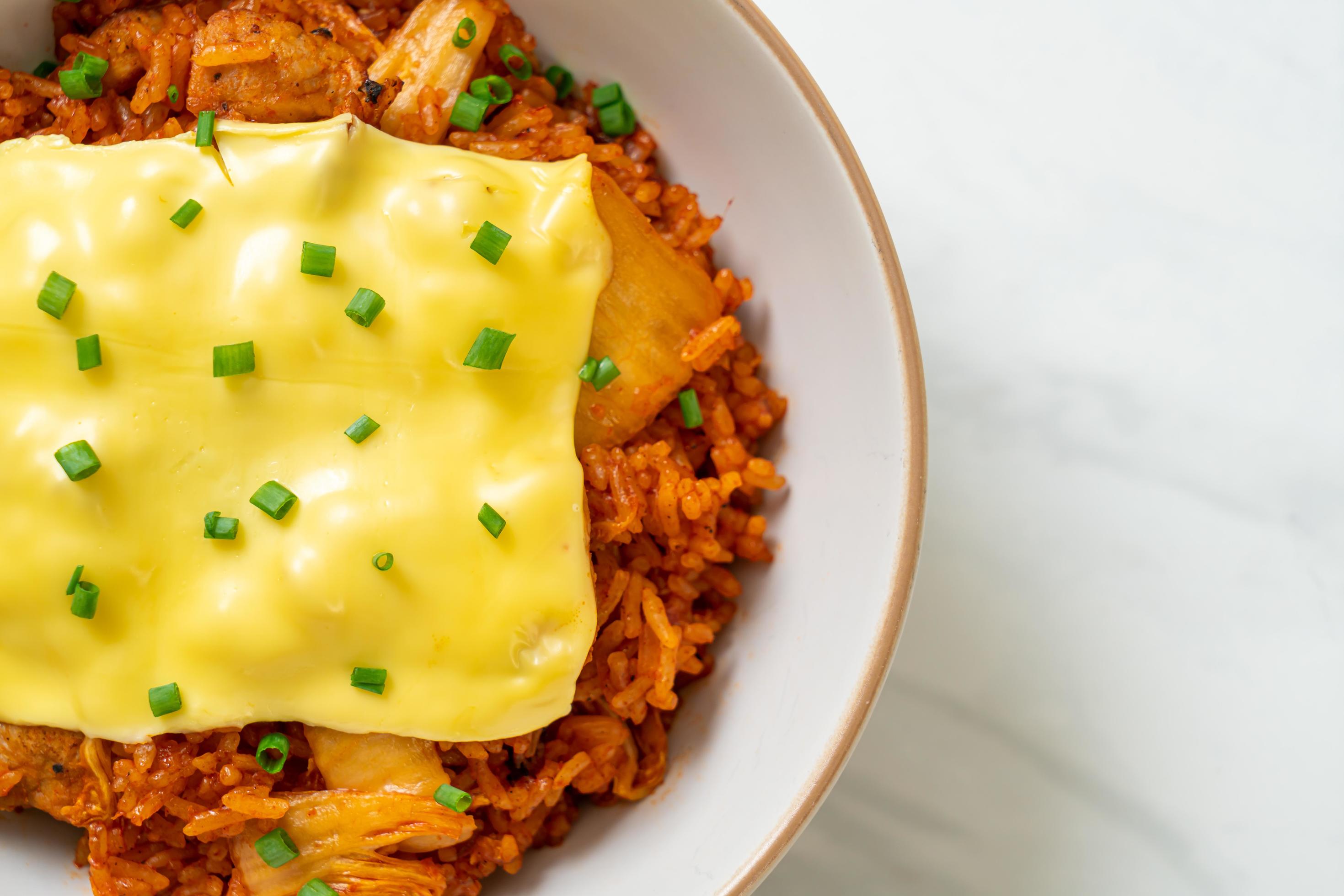 Kimchi fried rice with pork and topped cheese – Asian and fusion food style Stock Free