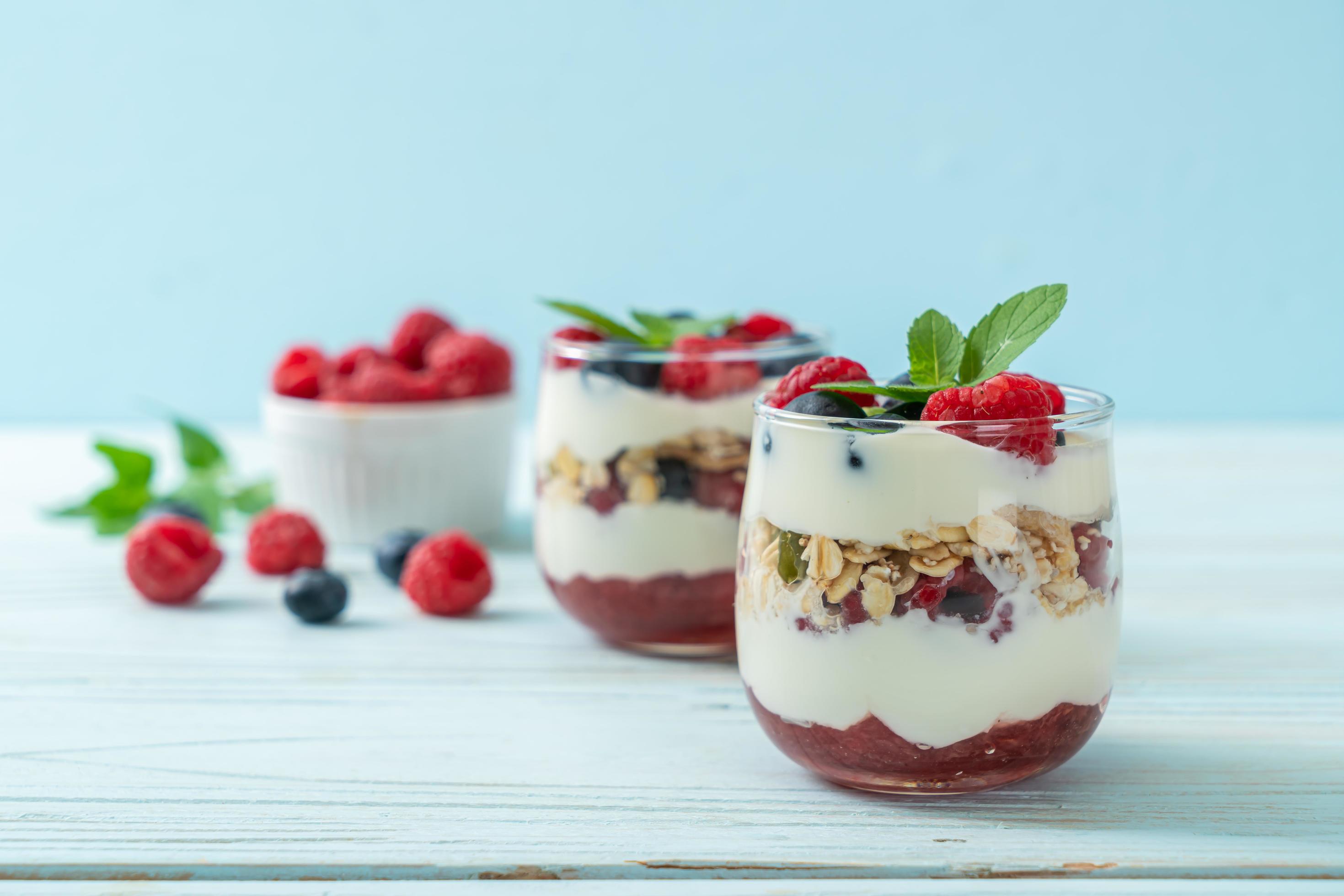 Homemade raspberry and blueberry with yogurt and granola – healthy food style Stock Free