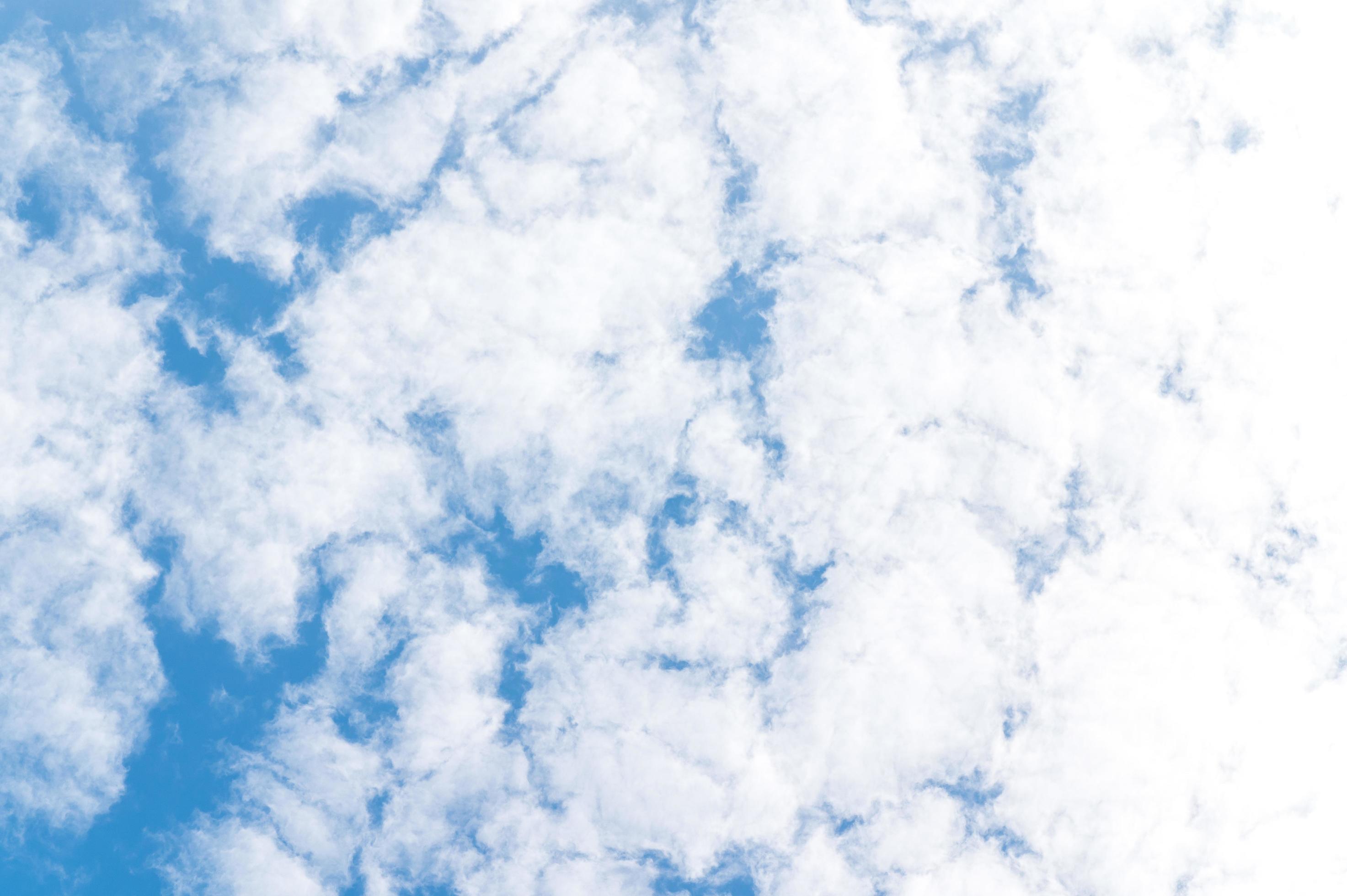 Beautiful white fluffy clouds in blue sky. Nature background from white clouds in sunny day Stock Free