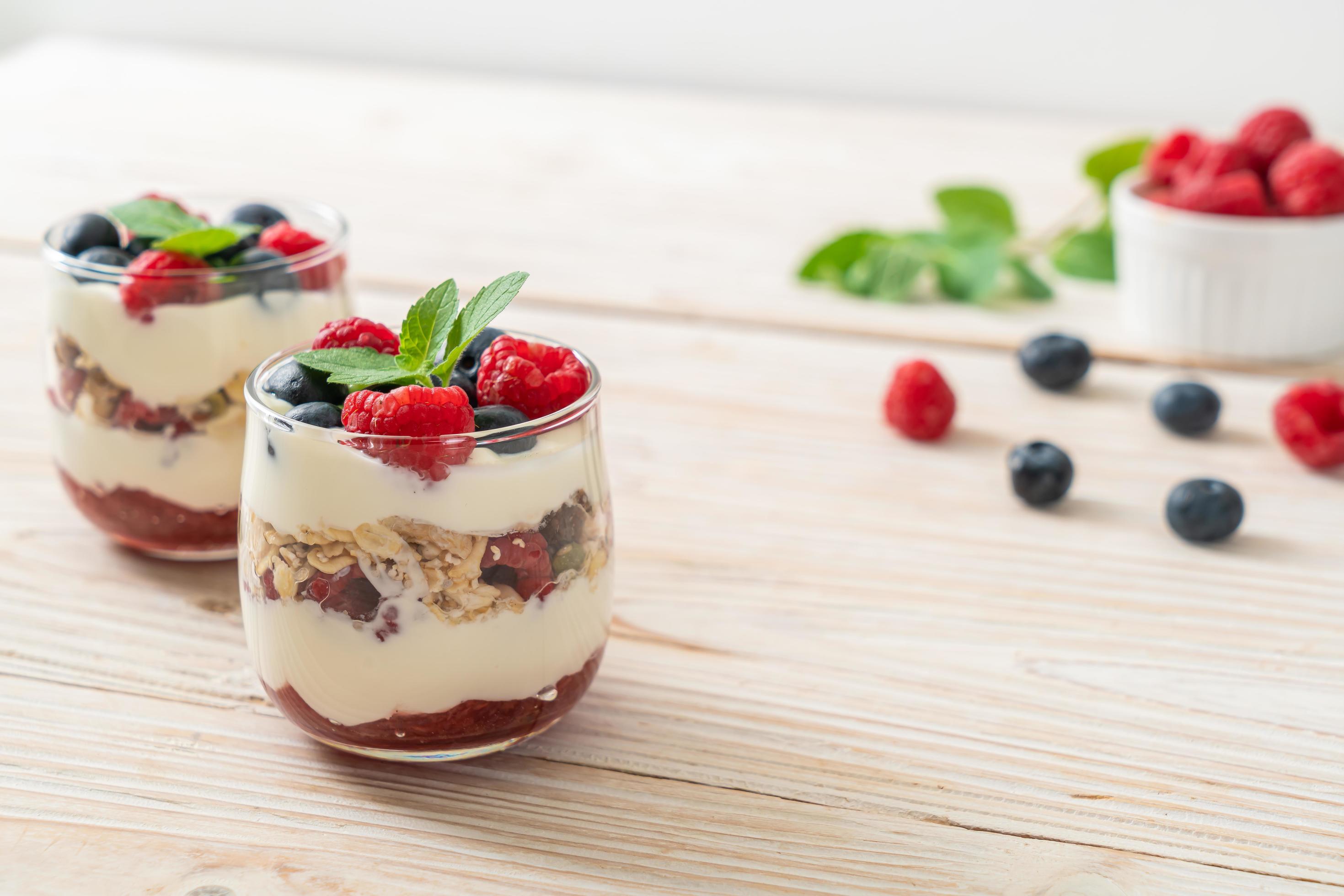 Homemade raspberry and blueberry with yogurt and granola – healthy food style Stock Free