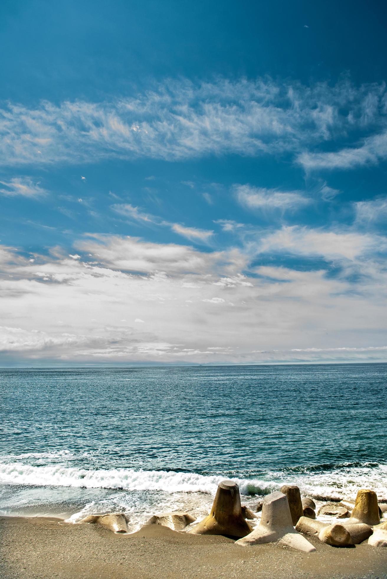 Tetrapods In The Beach Under The Blue Sky Stock Free