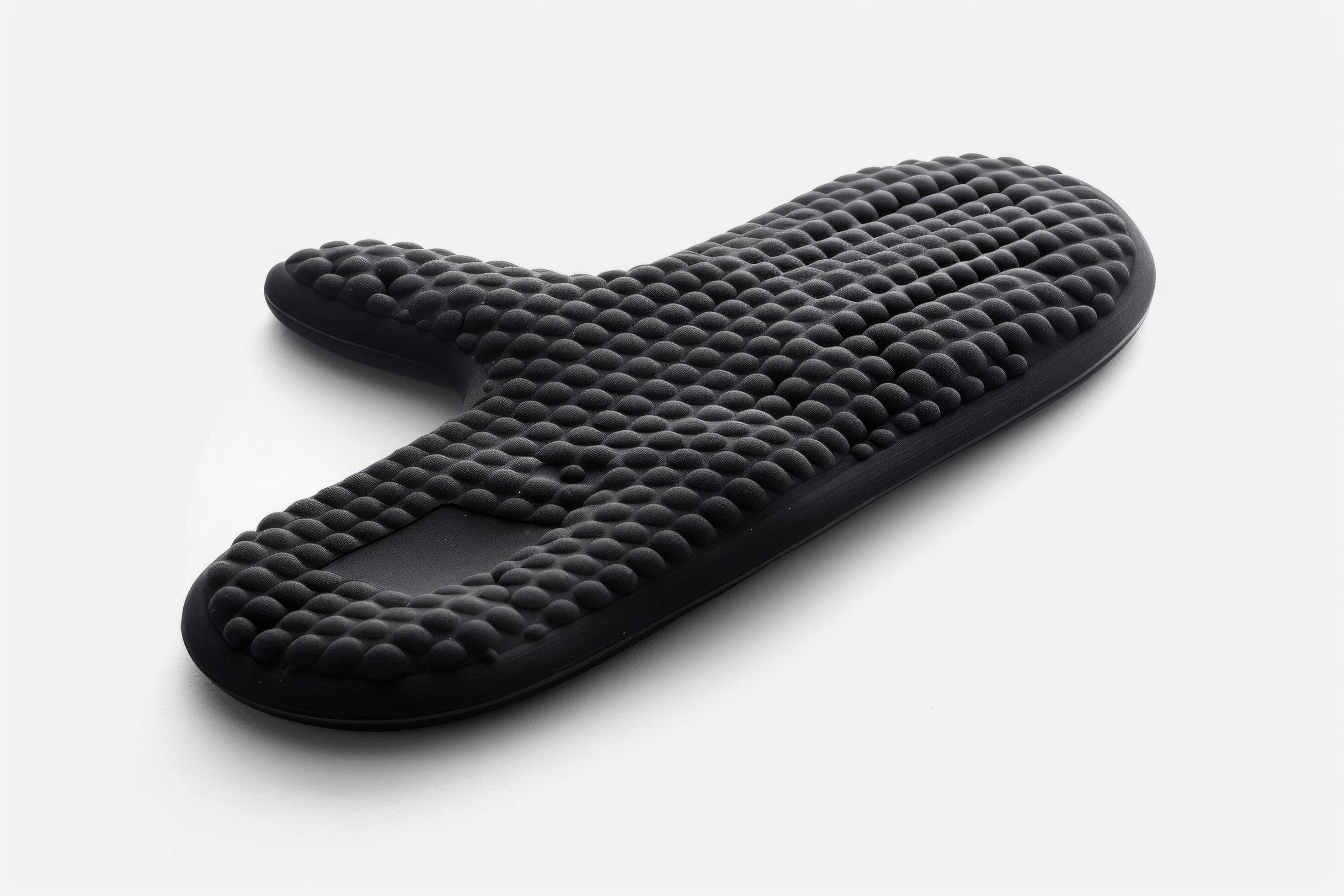 Black silicone oven mitt on a white background. Stock Free