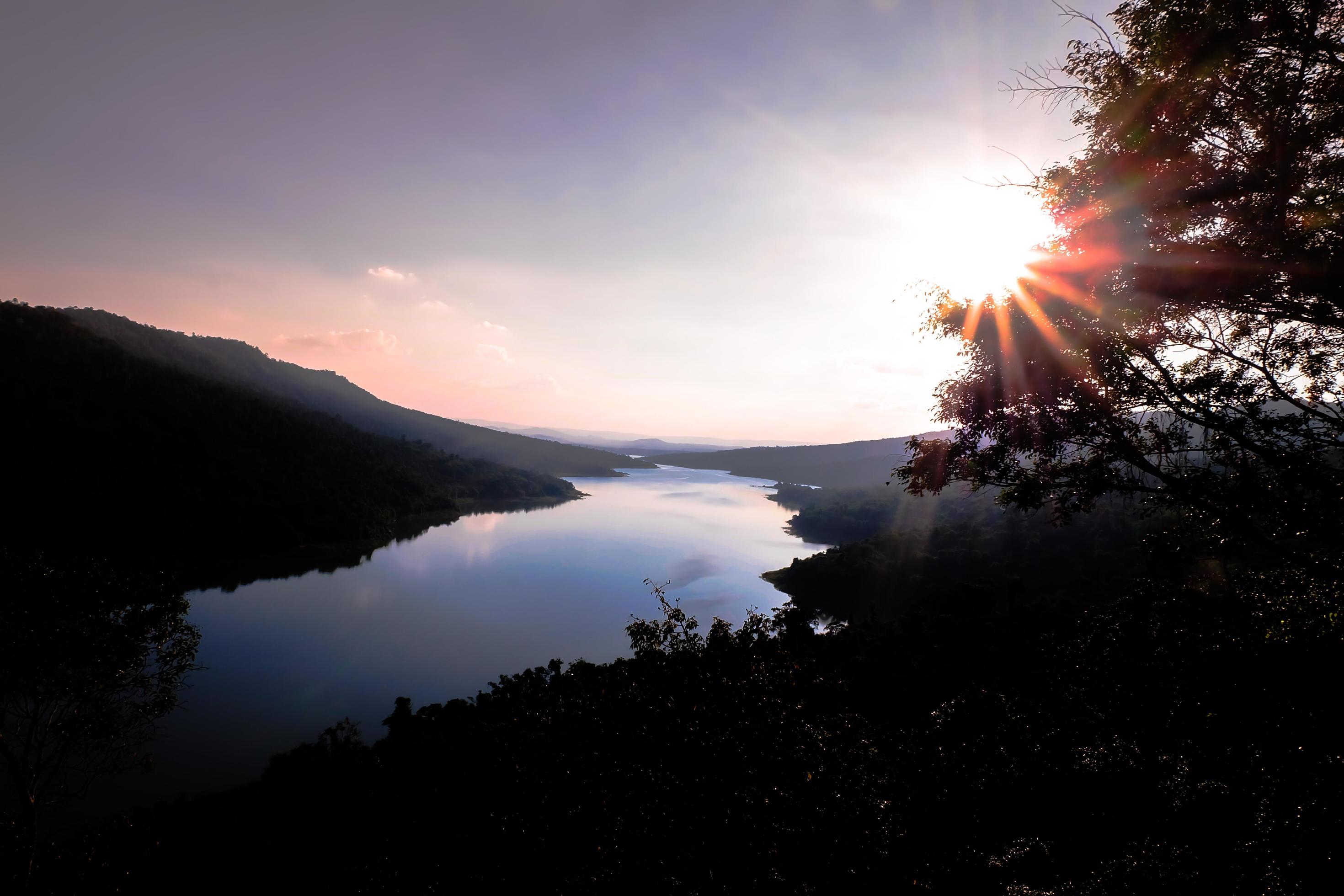 Beautiful natural landscape mountain and river views sky at sunset Stock Free