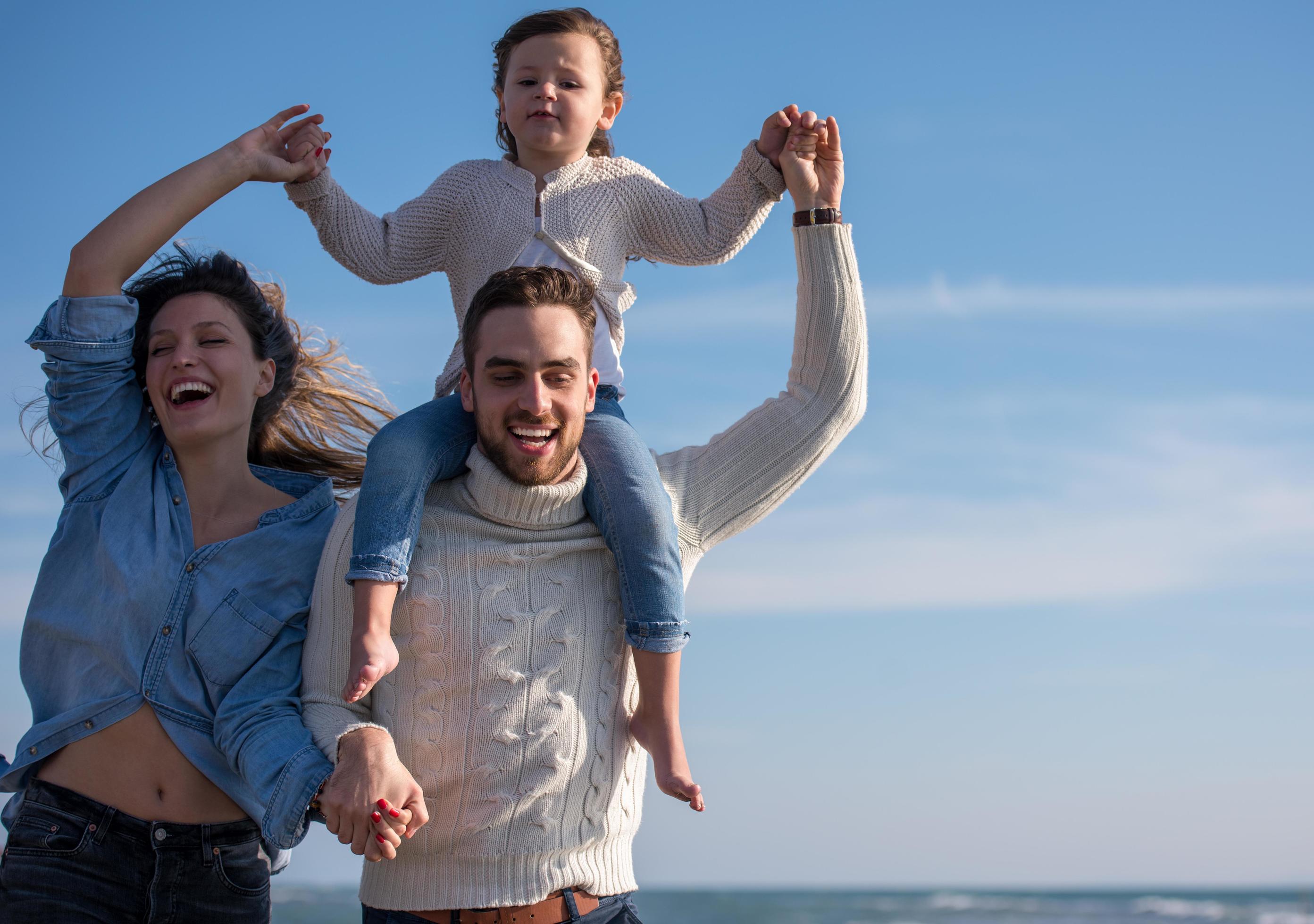 Young family enjoying vecation during autumn Stock Free