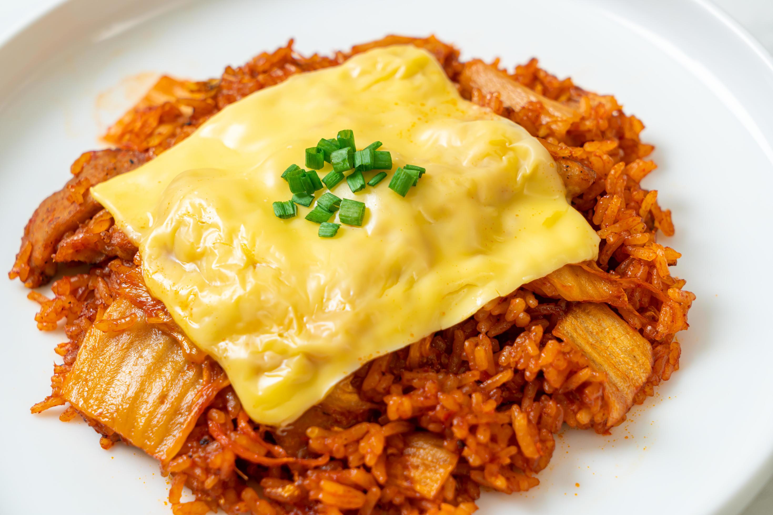 Kimchi fried rice with pork and topped cheese – Asian and fusion food style Stock Free