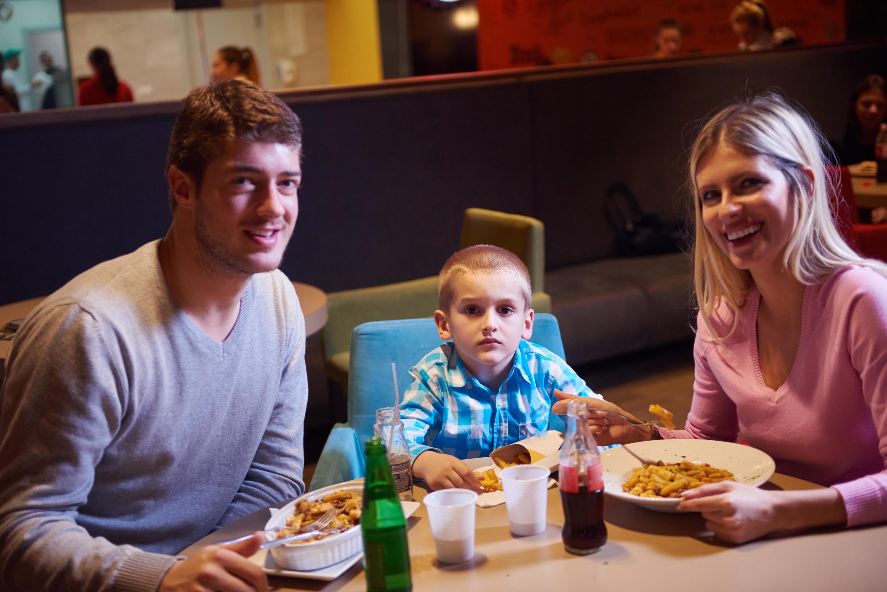 family having lunch in shopping mall Stock Free