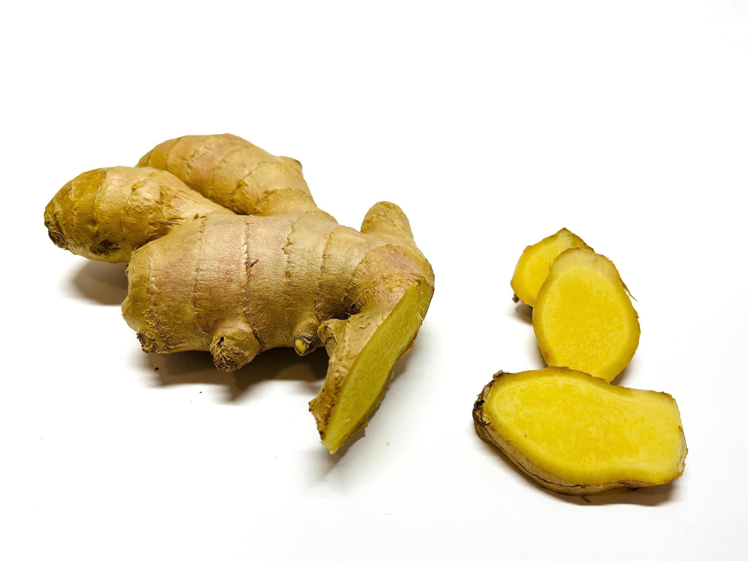 Ginger root with sliced on white background Stock Free