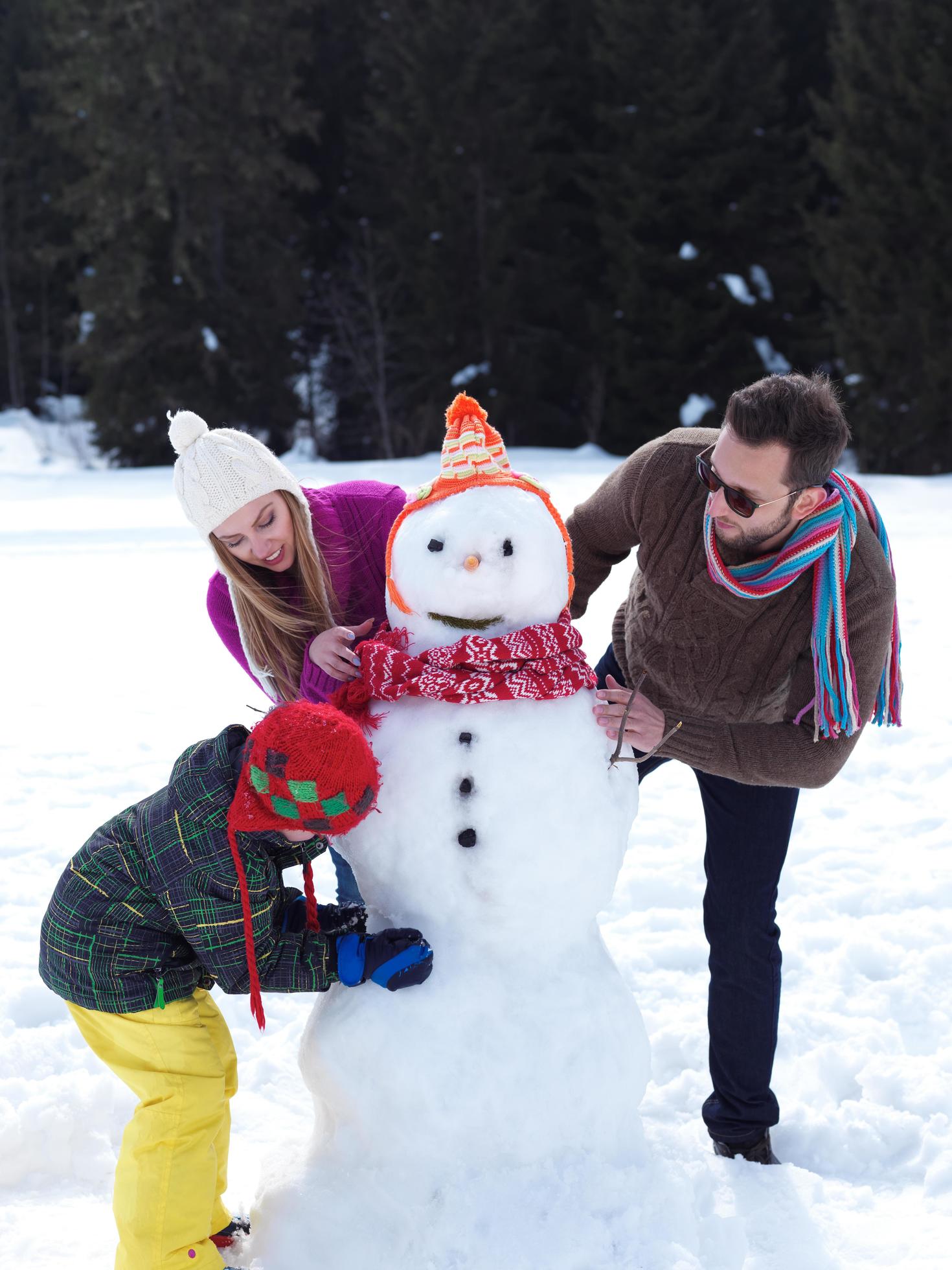 happy family making snowman Stock Free