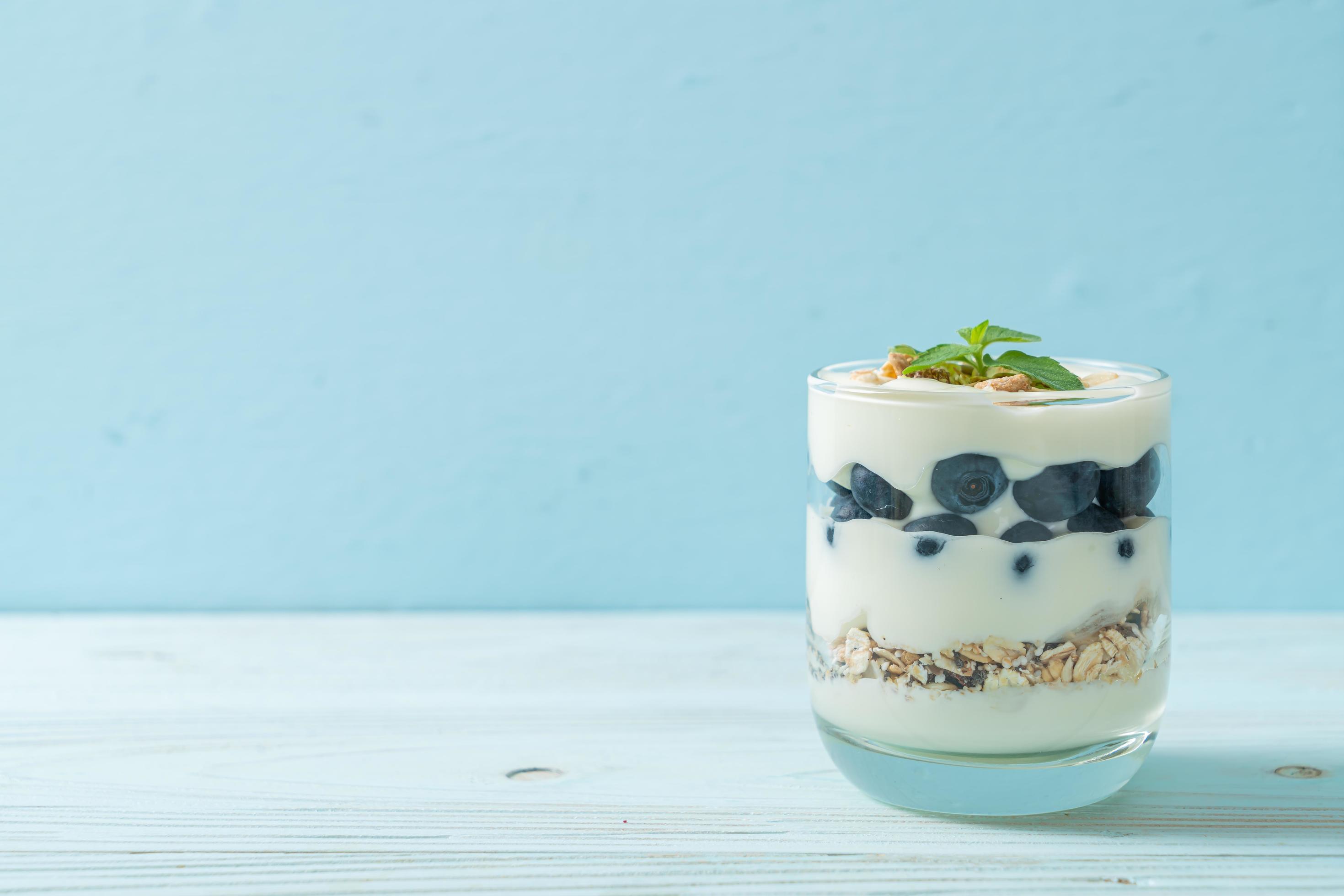 Fresh blueberries and yogurt with granola – Healthy food style Stock Free