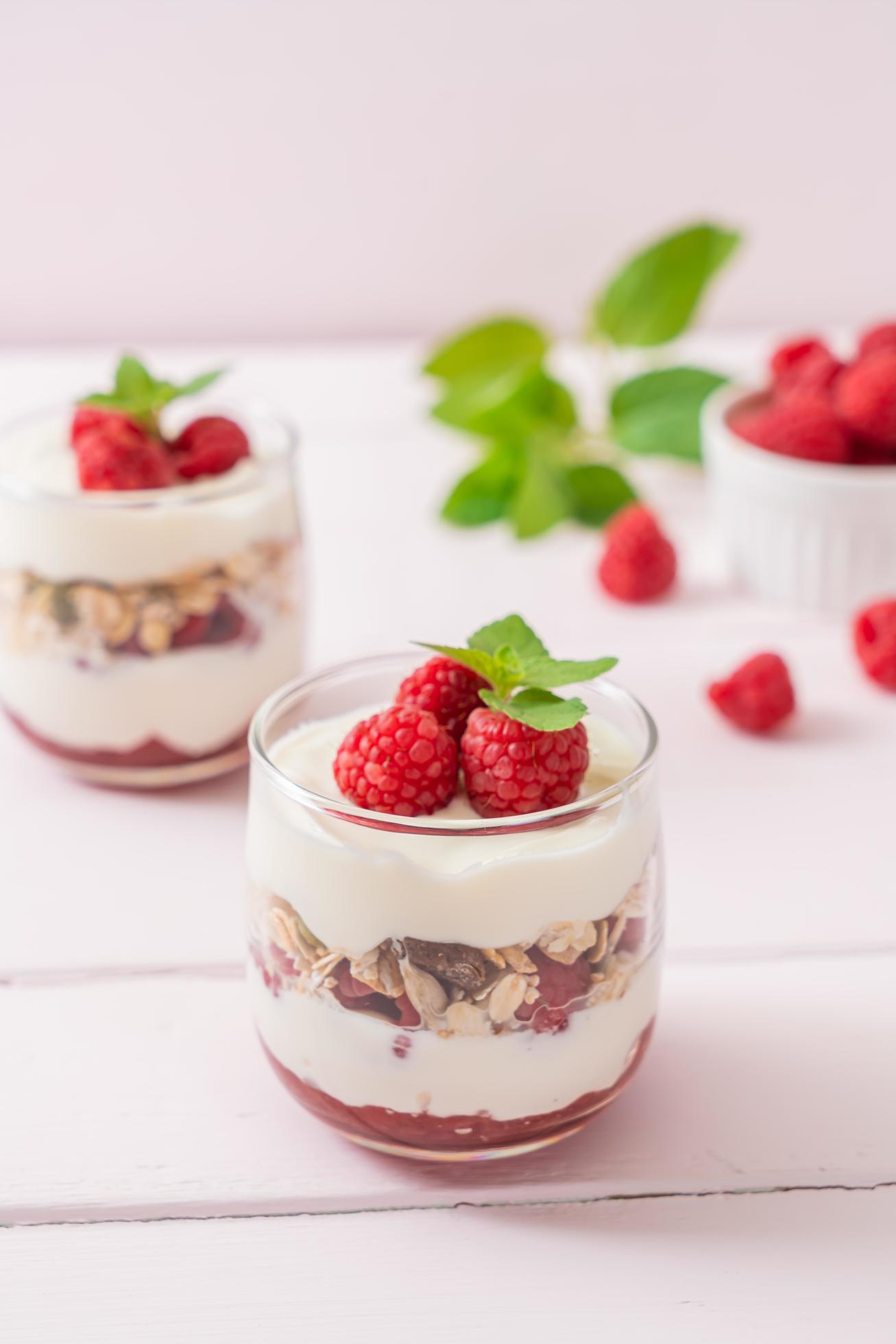 Fresh raspberry and yogurt with granola – Healthy food style Stock Free