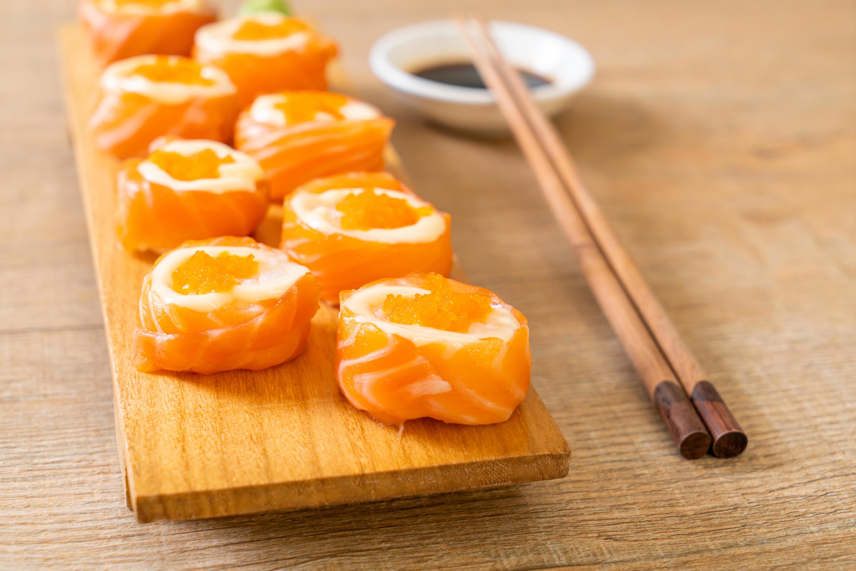 Fresh salmon sushi roll with mayonnaise and shrimp egg – Japanese food style Stock Free