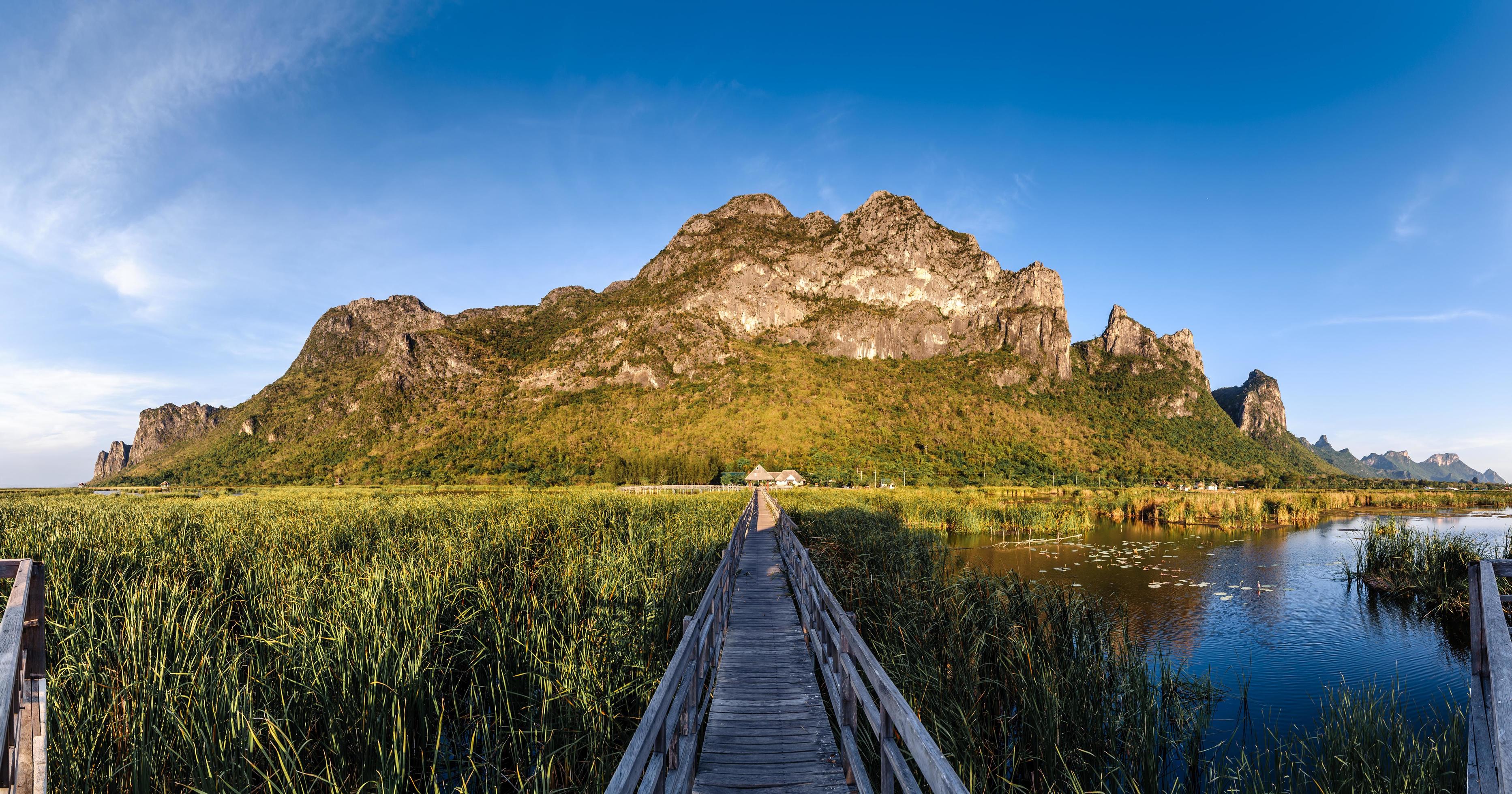 Wooden Bridge in Lotus Lake Under Cloudy Sky at Khao Sam Roi Yod National Park, Thailand. Stock Free