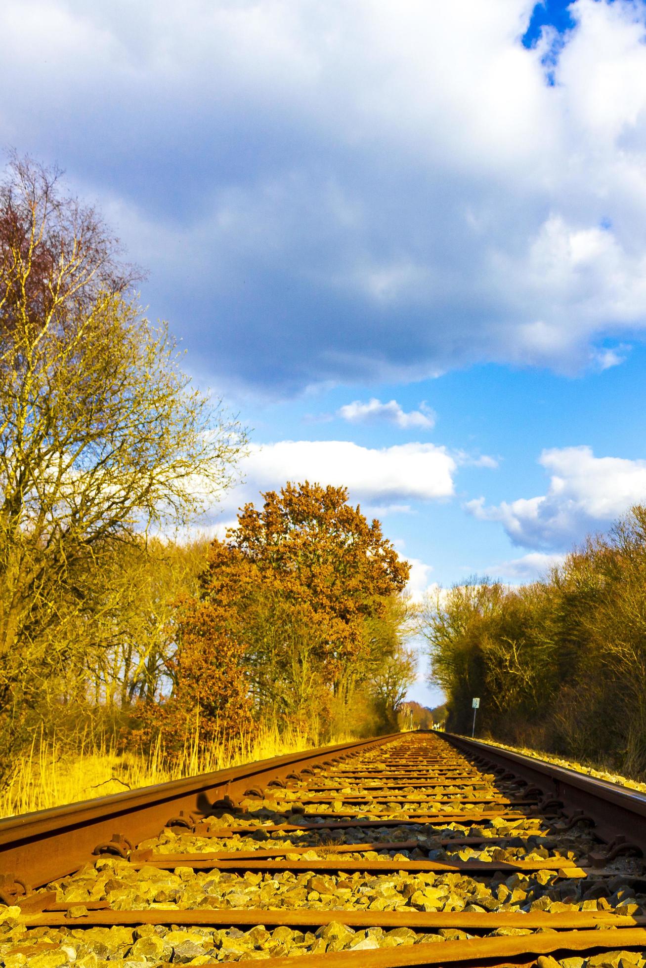 Train tracks through nature to infinity in Germany. Stock Free