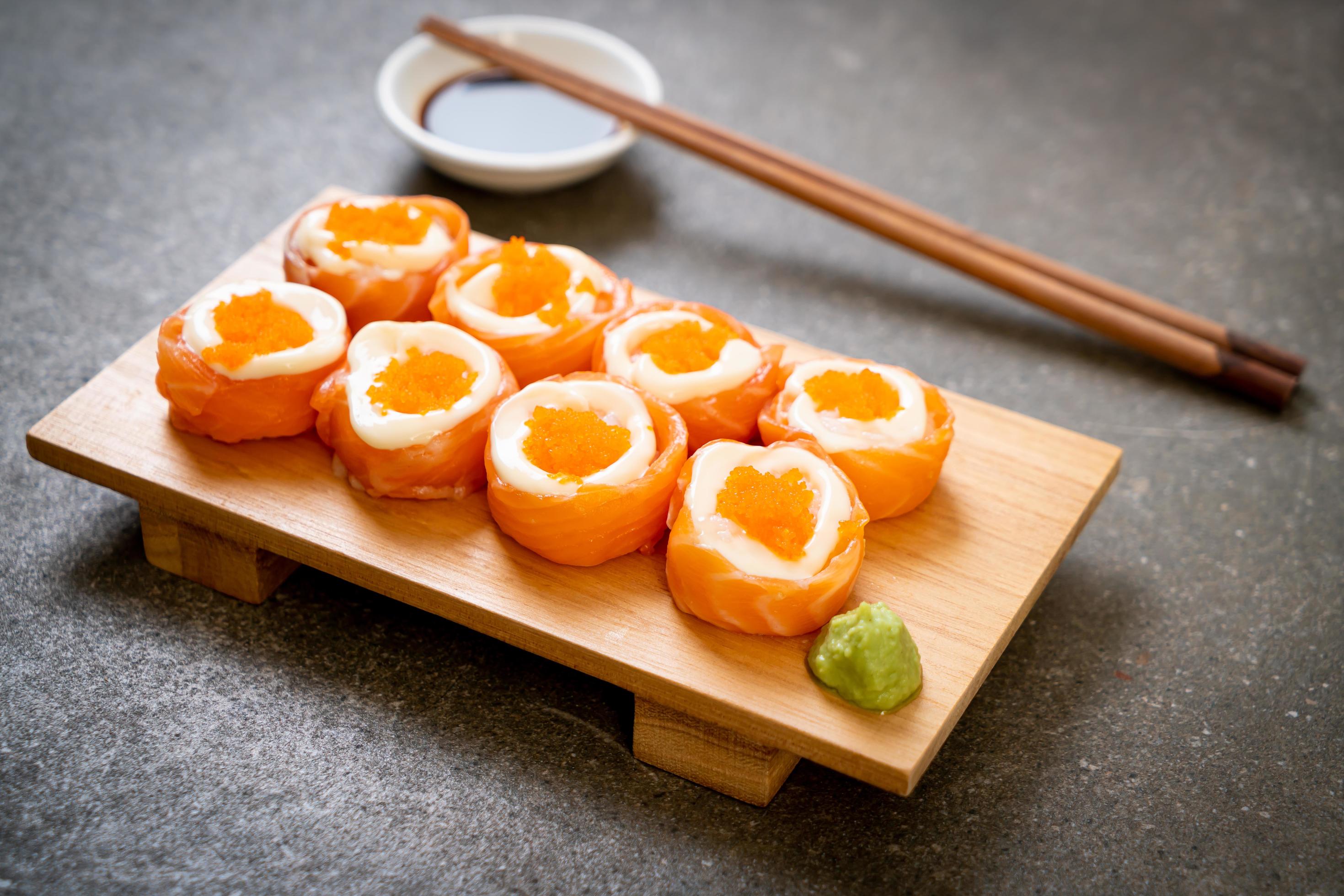 Fresh salmon sushi roll with mayonnaise and shrimp egg – Japanese food style Stock Free