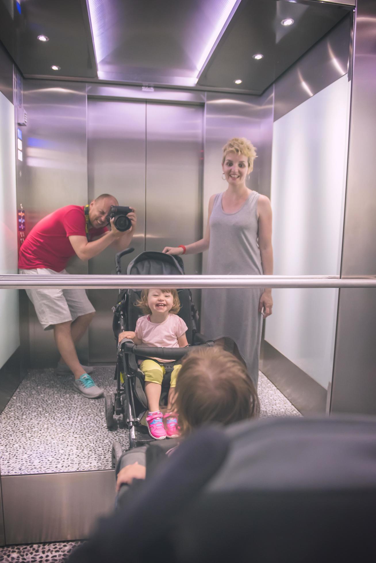 happy family in the elevator Stock Free