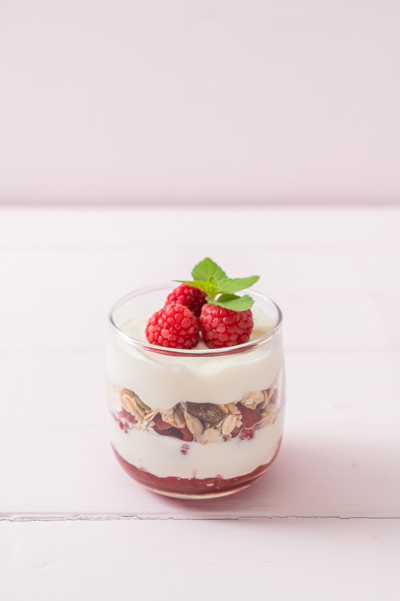 Fresh raspberry and yogurt with granola – Healthy food style Stock Free