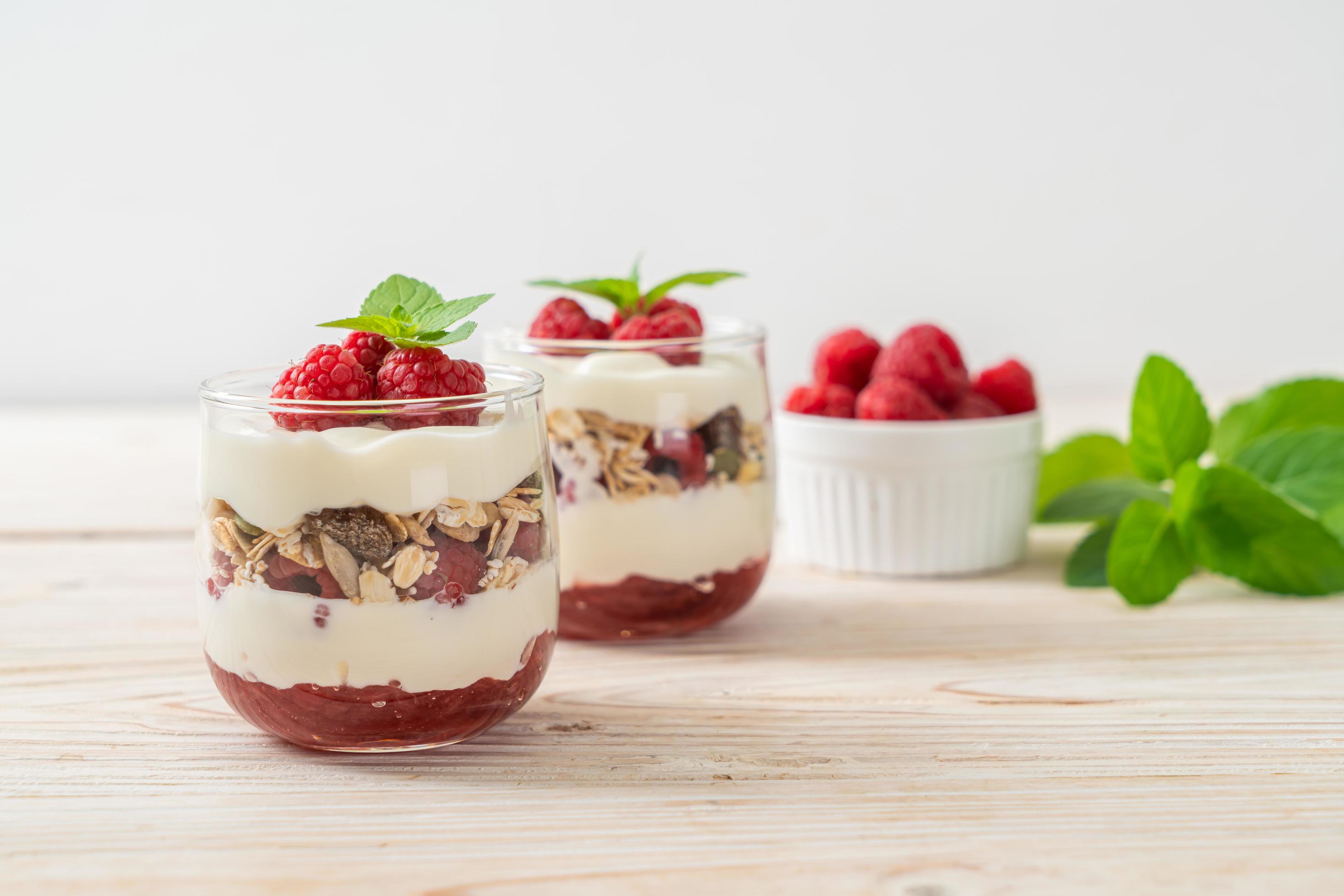 Fresh raspberry and yogurt with granola – Healthy food style Stock Free