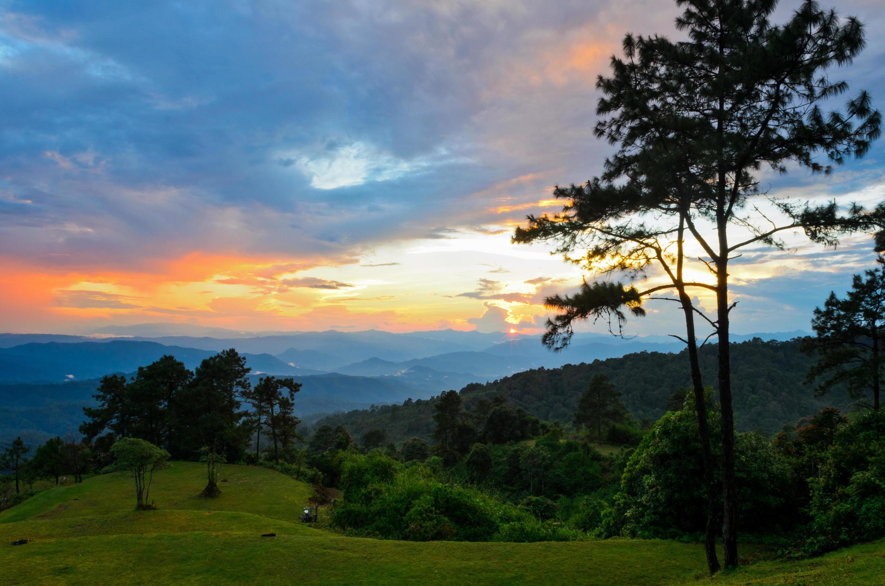 Sunset over high mountain range Stock Free