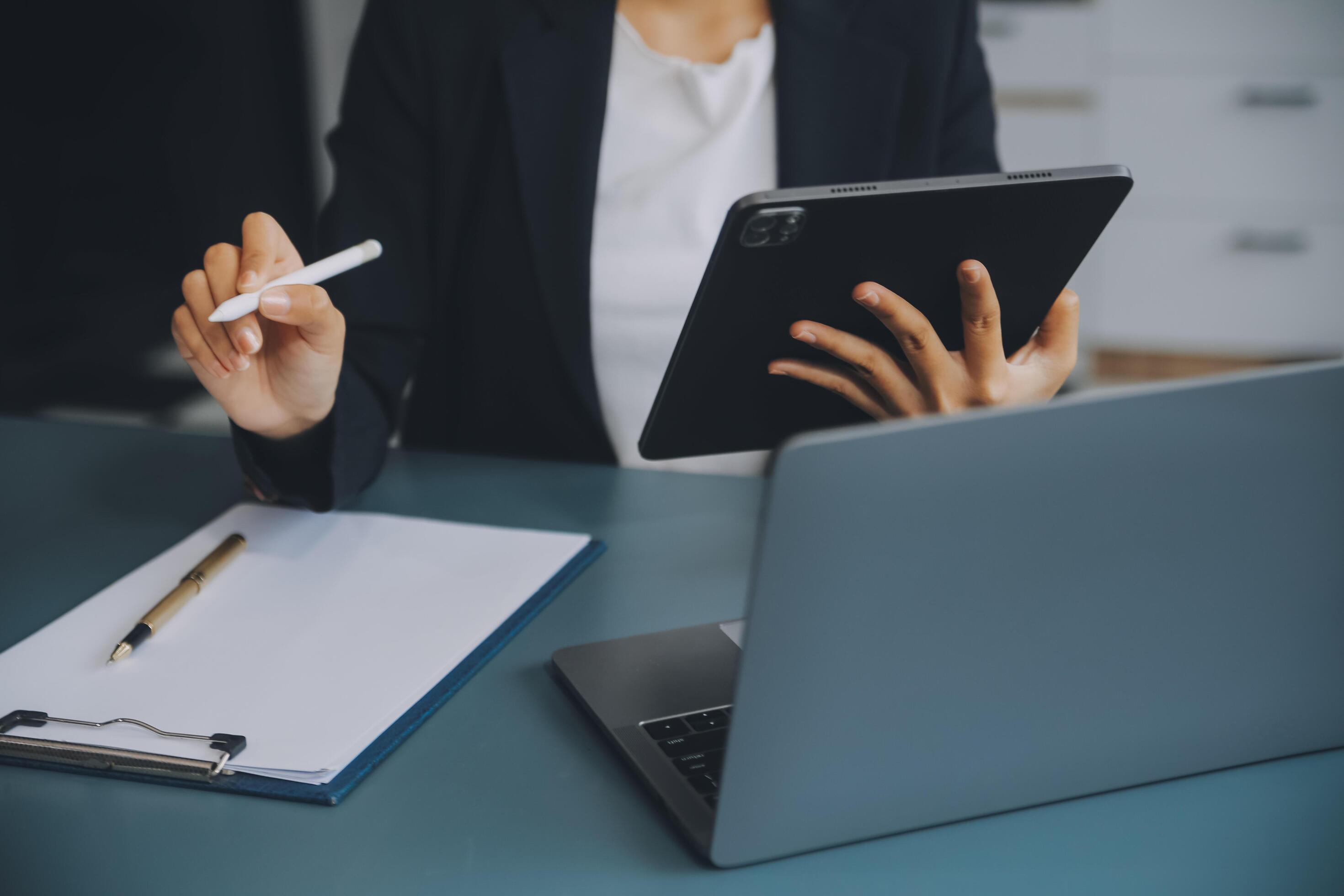 Portrait of a successful business woman using digital tablet Stock Free