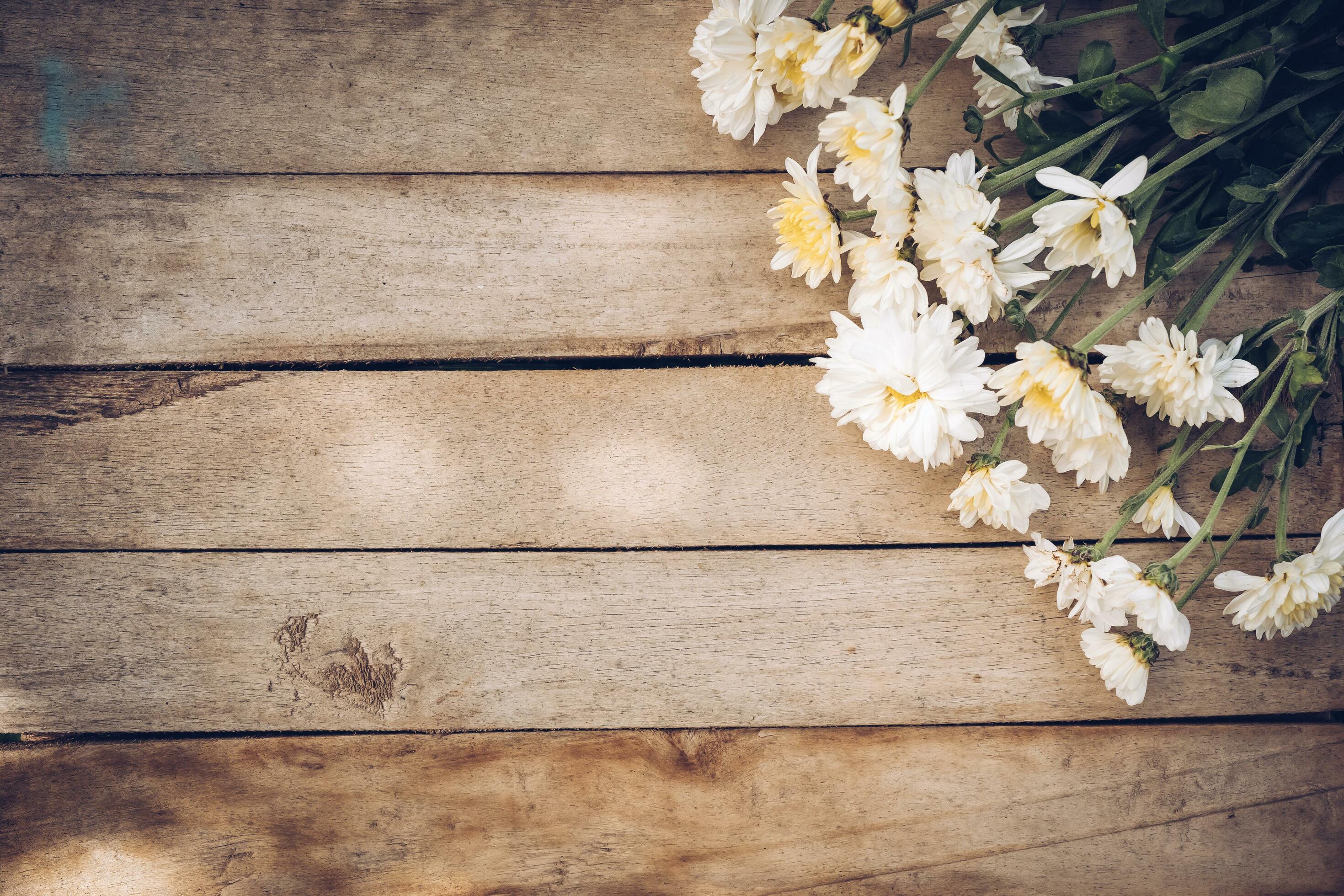 Flowers on old grunge wooden table texture and background with copy space. Stock Free