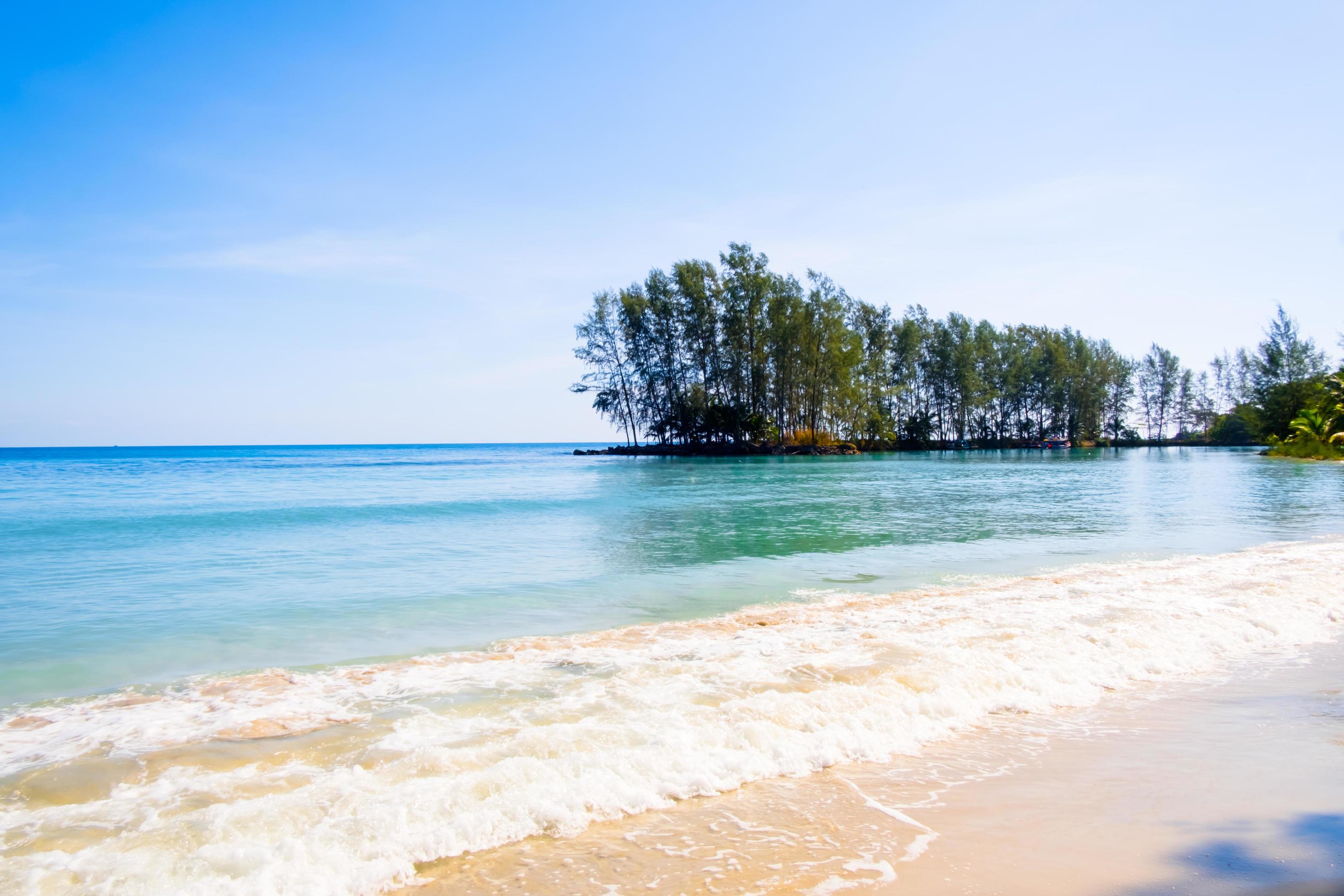 Beautiful sea on tropical beach as summer landscape with blue sky Stock Free