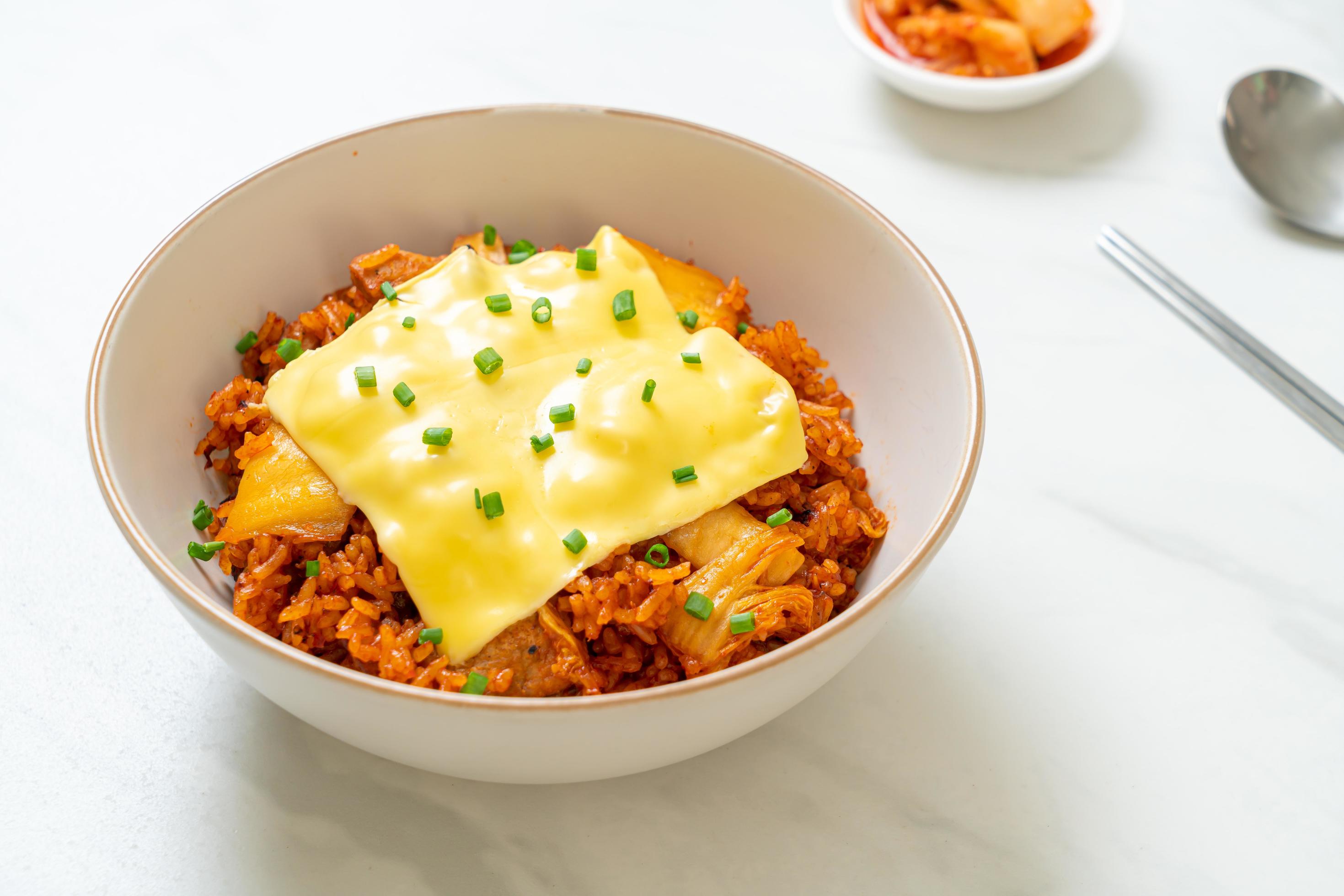 Kimchi fried rice with pork and topped cheese – Asian and fusion food style Stock Free