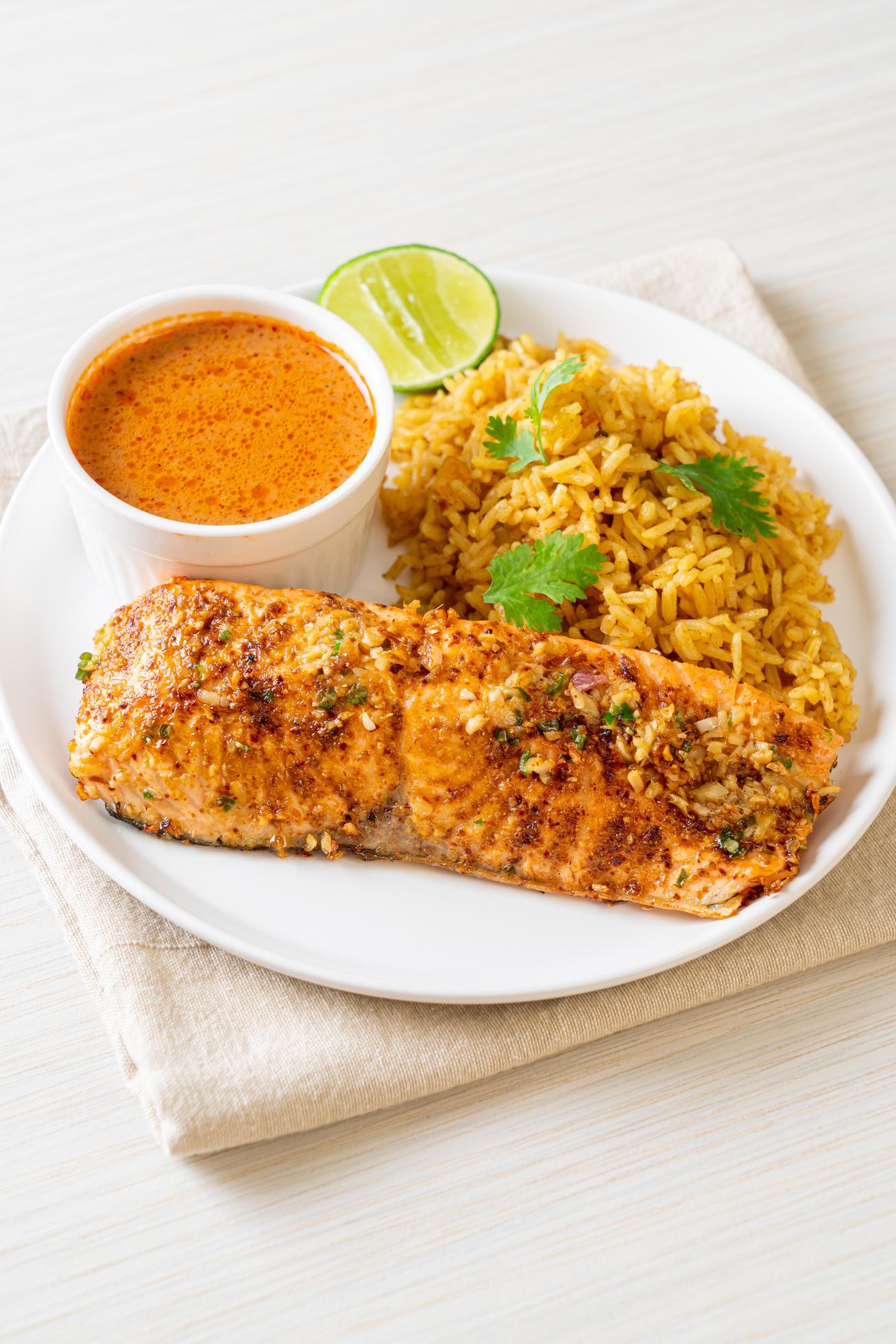 Pan-seared salmon tandoori with masala rice – Muslim food style Stock Free