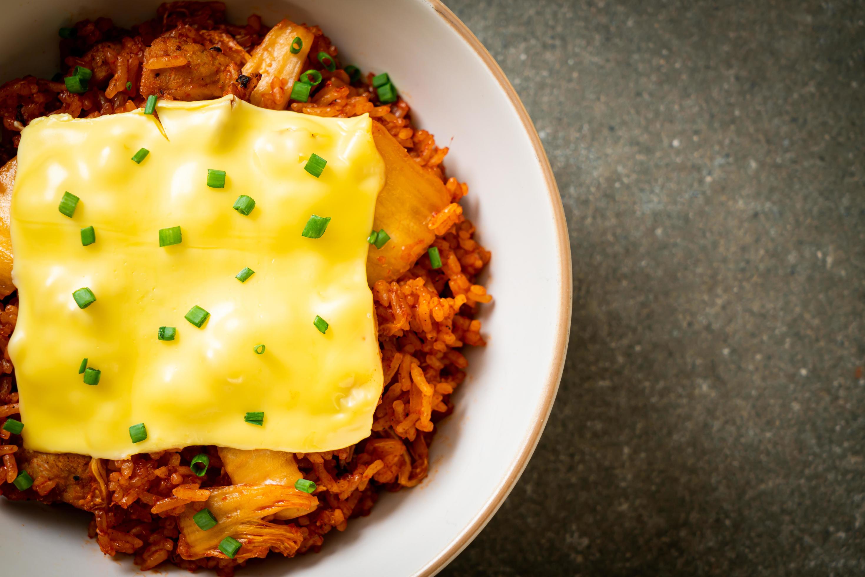 Kimchi fried rice with pork and topped cheese – Asian and fusion food style Stock Free