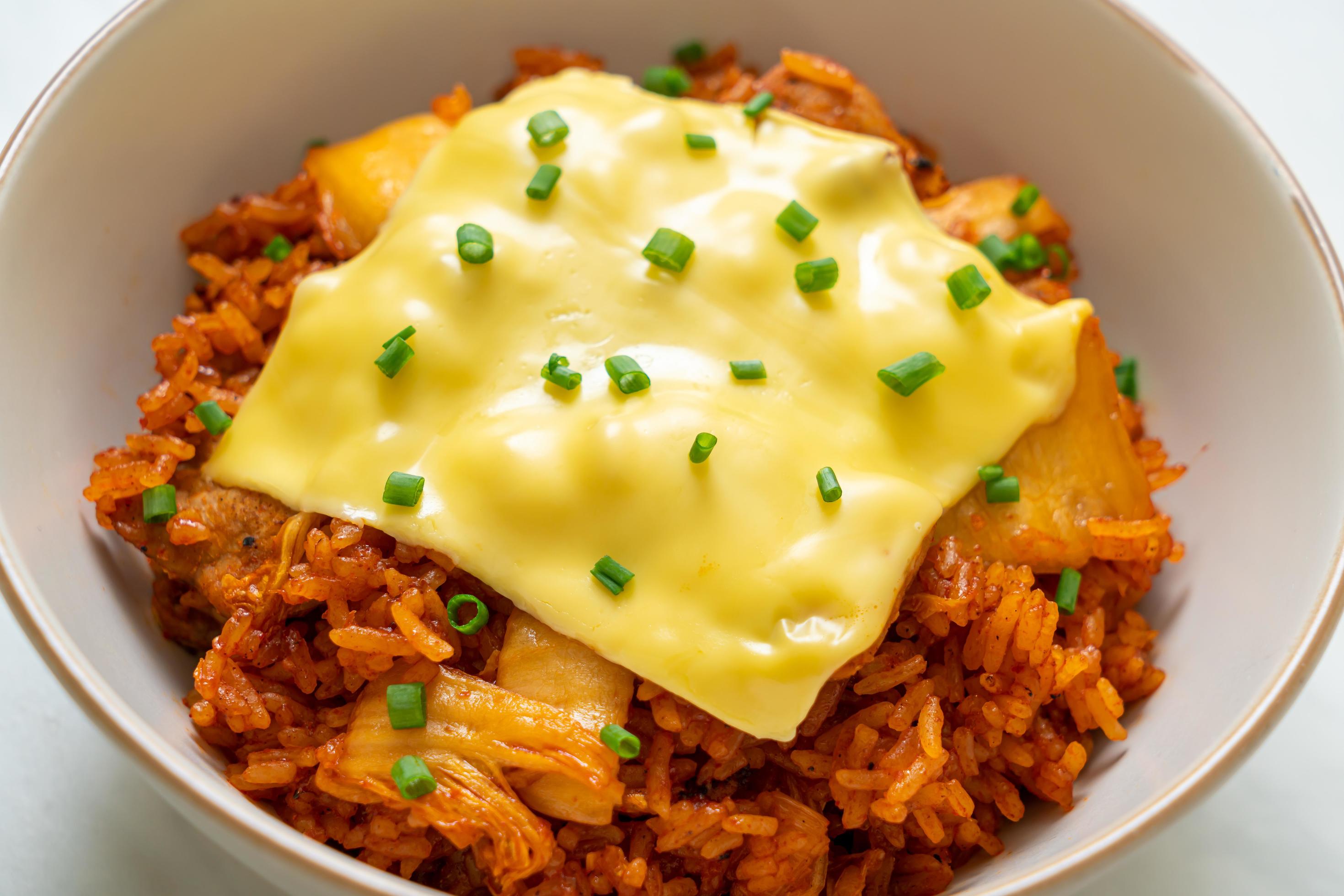 Kimchi fried rice with pork and topped cheese – Asian and fusion food style Stock Free