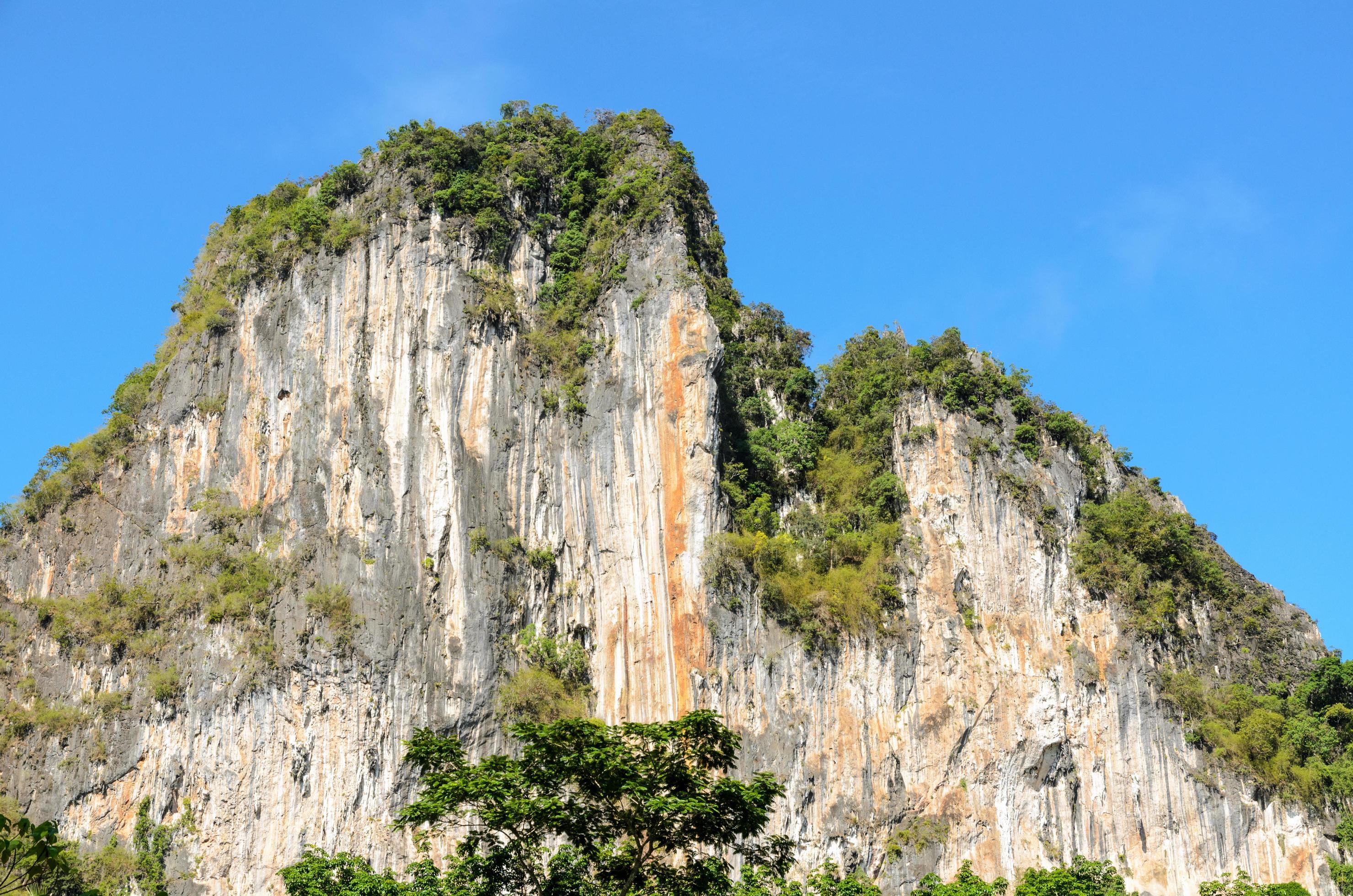 High cliffs on blue sky Stock Free