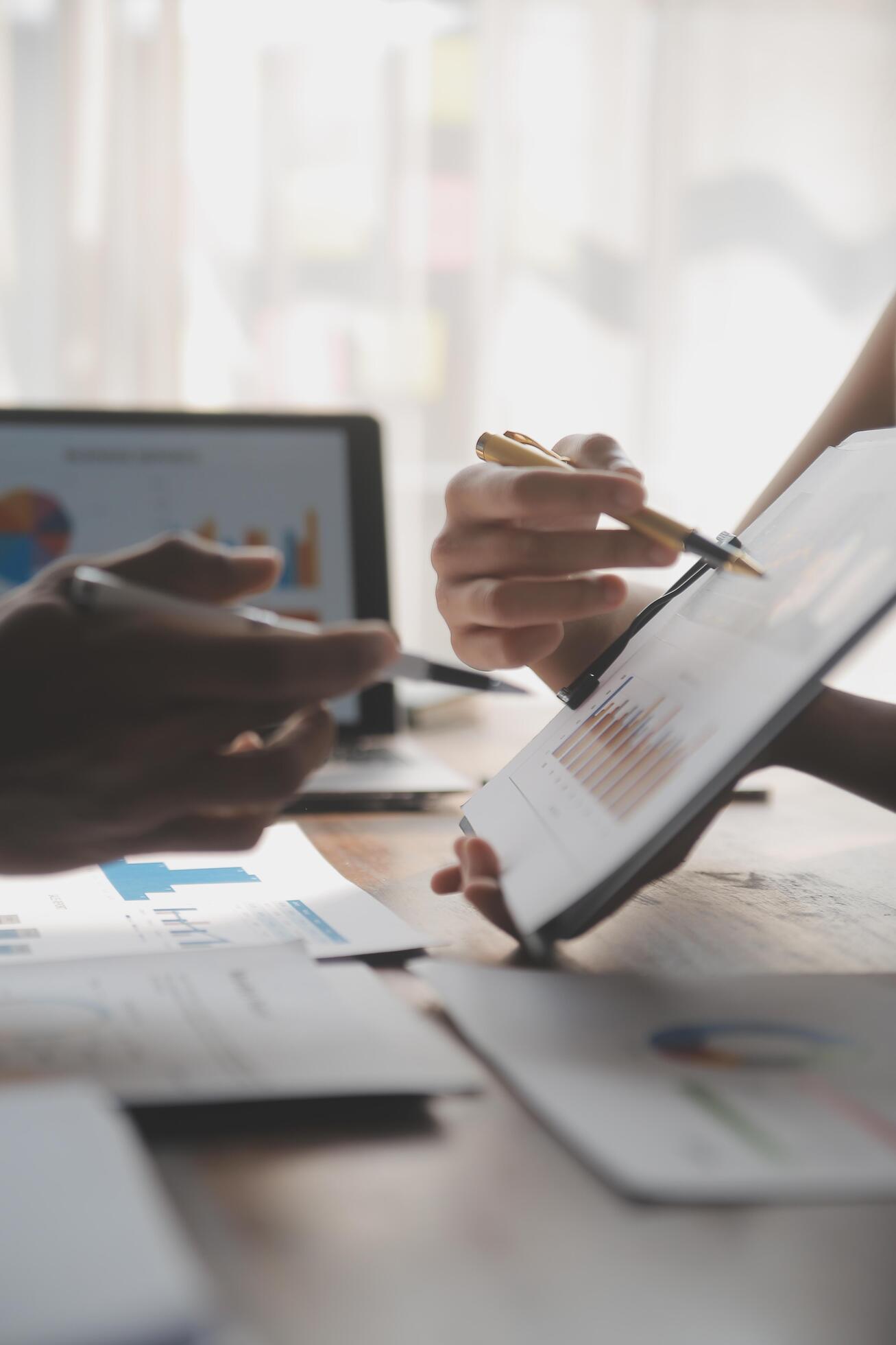 
									Close up of Business team analyzing income charts and graphs with modern laptop computer. Business analysis and strategy concept. Stock Free