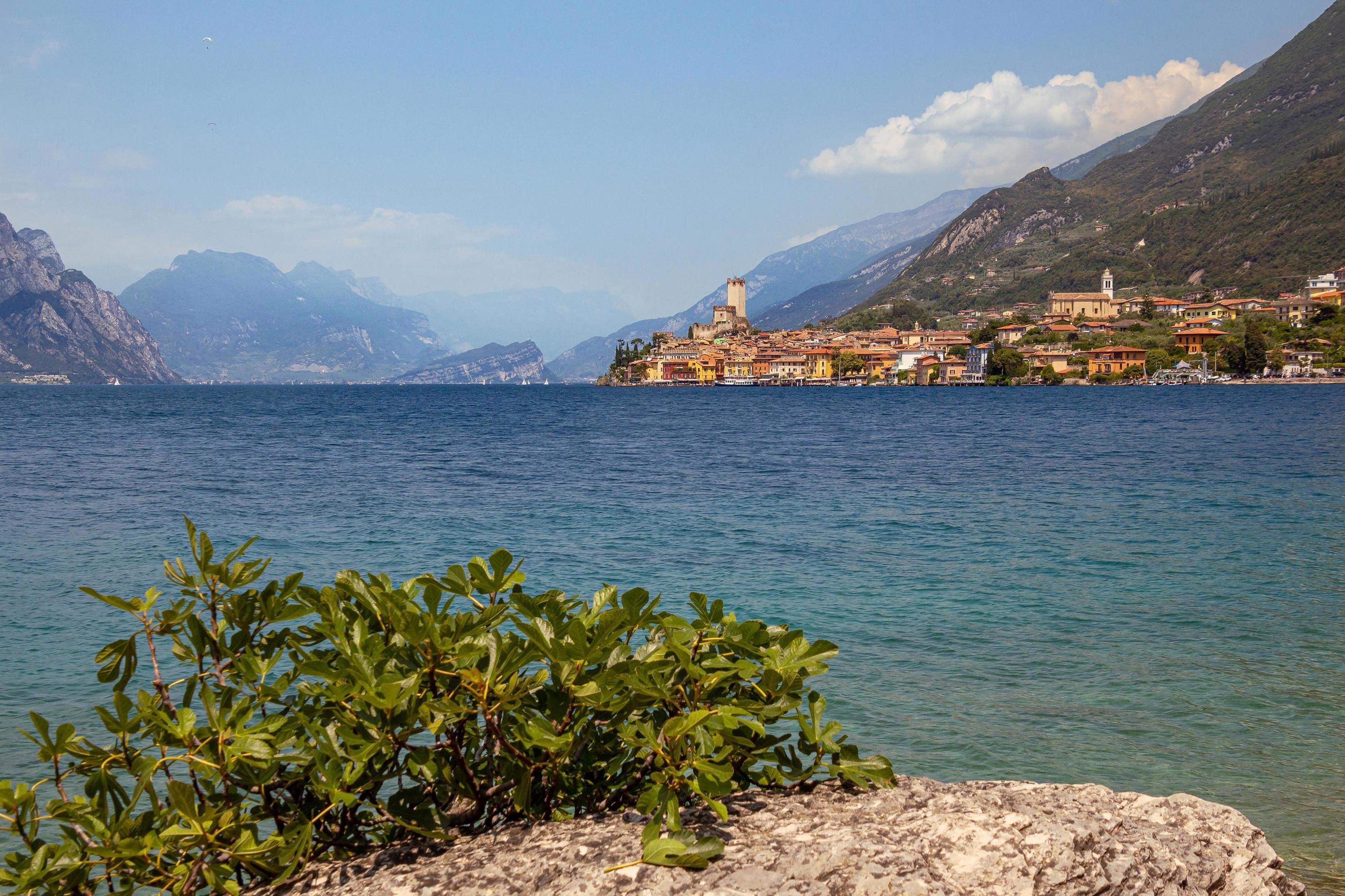 View from lakeside walkway to famous mediterrean town Malcesine, Lago di Garda Garda lake, Italy Stock Free