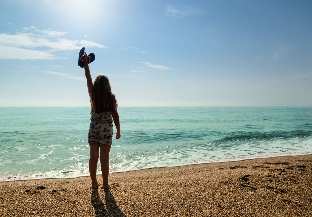 Happy girl at the beach Stock Free