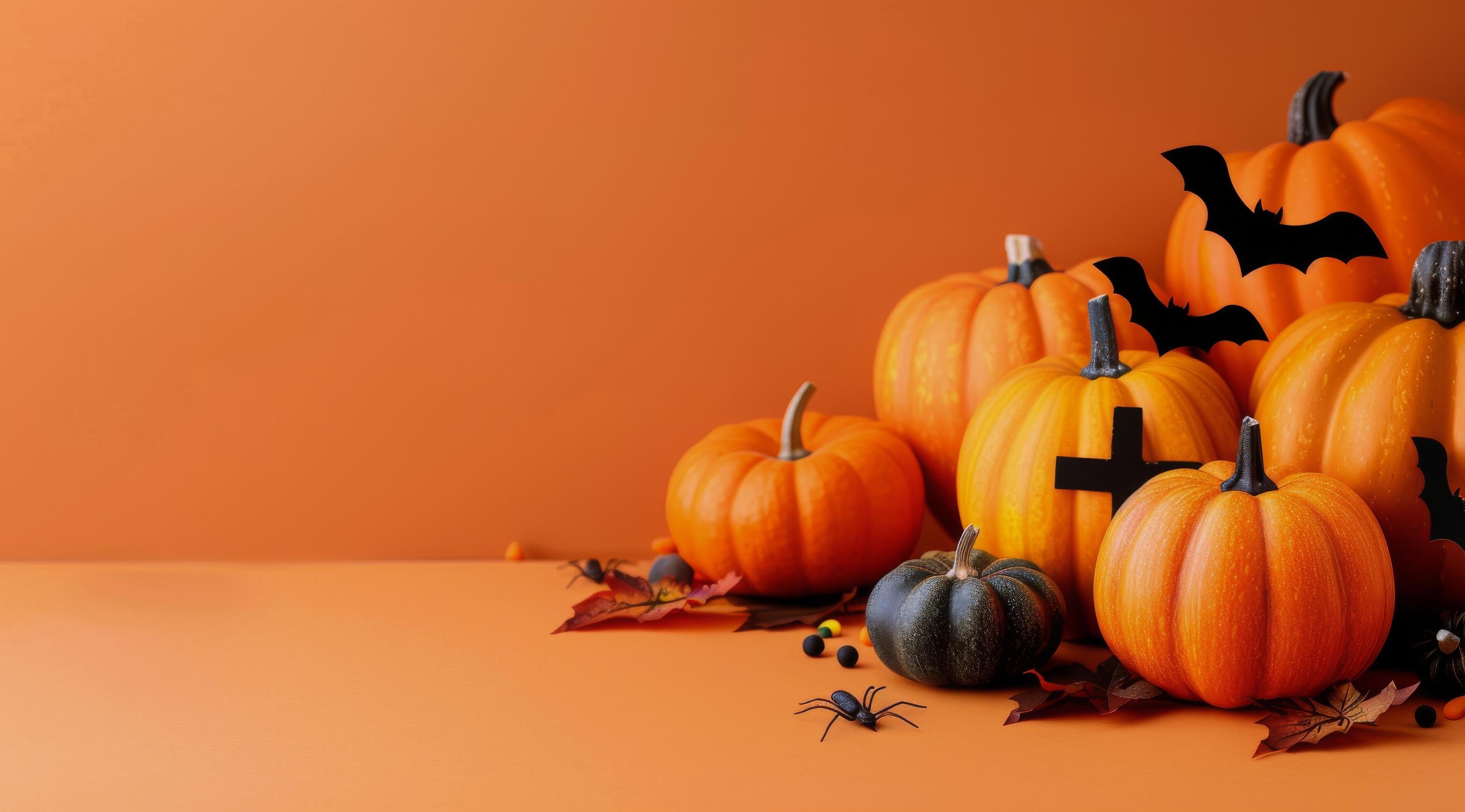 
									Halloween Pumpkins and Bats on Orange Background Stock Free