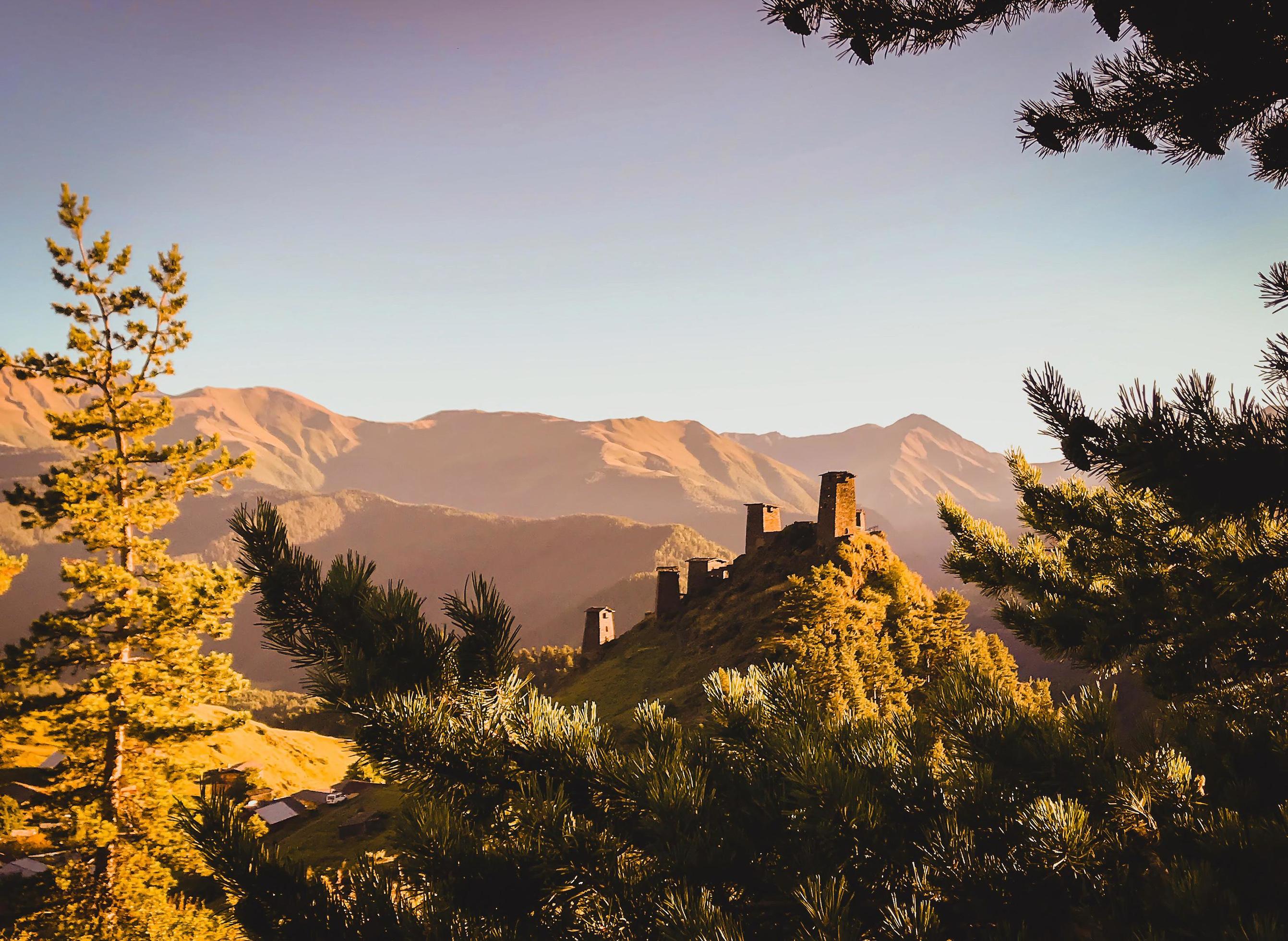 Keselo hill with traditional tushetian towers and tranquil landscape. Travel Tusheti national park historical landmarks Stock Free