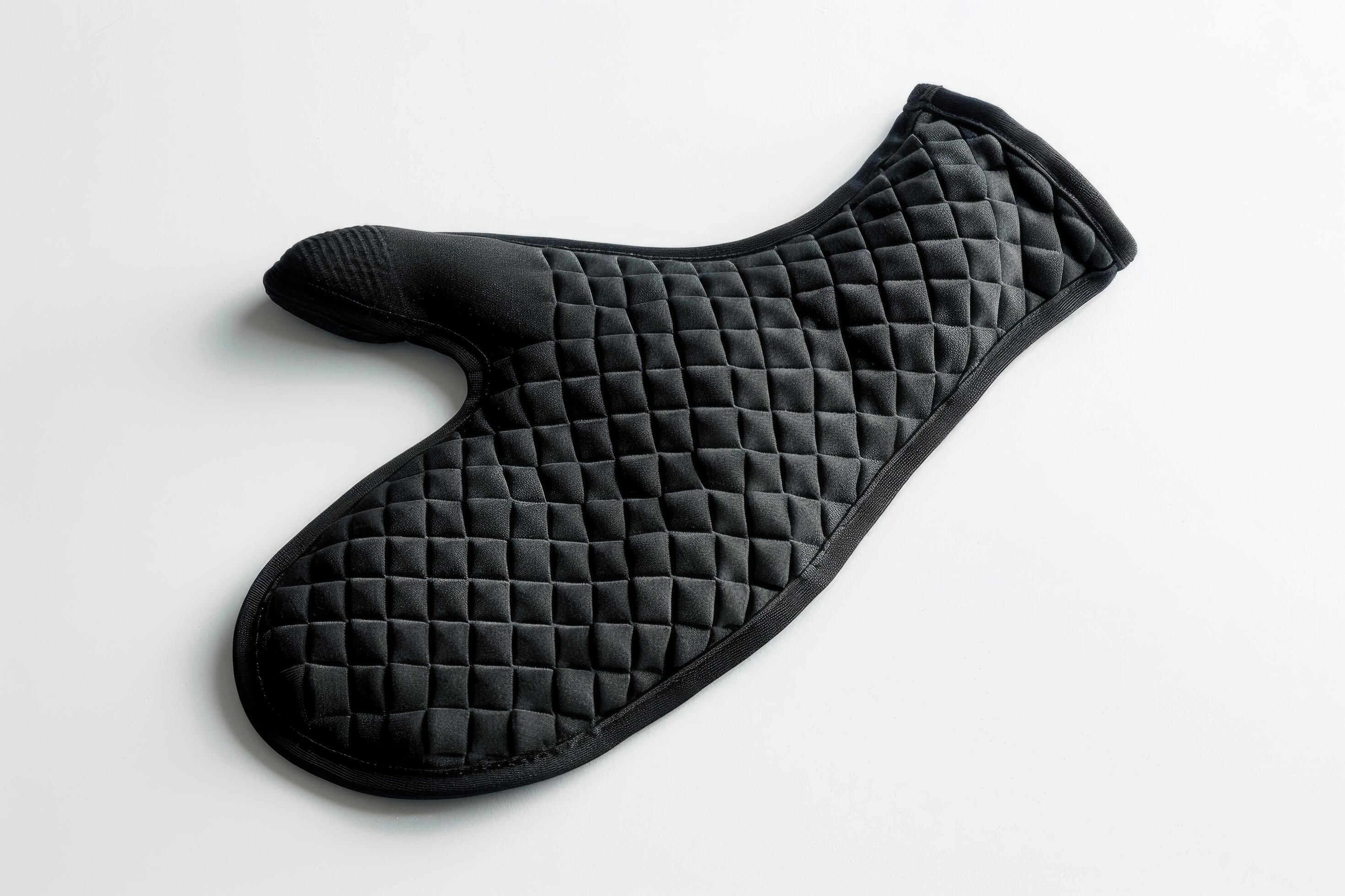 Black silicone oven mitt on a white background. Stock Free