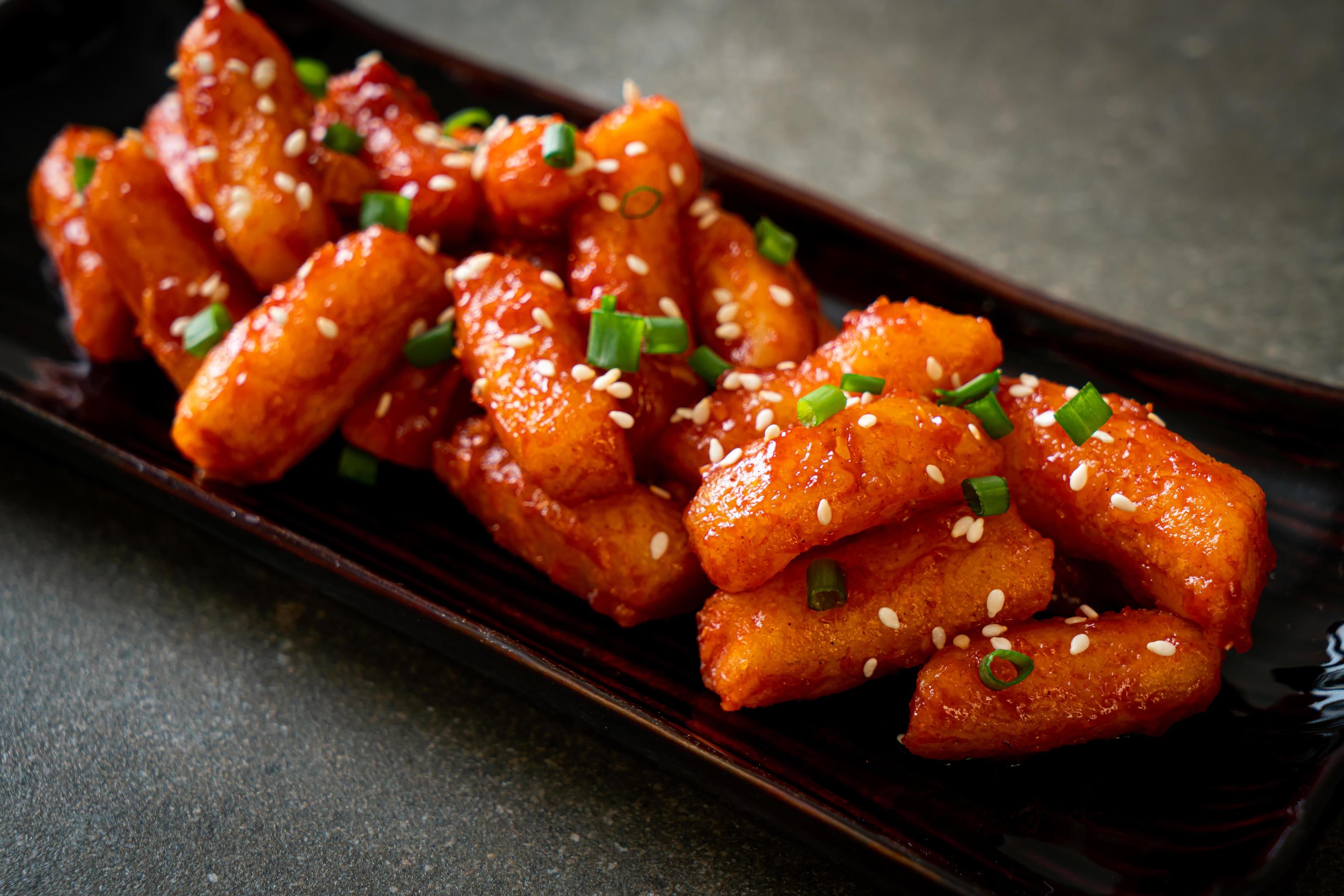 Deep-fried Korean rice cake, or Tteokbokki, with spicy sauce – Korean food style Stock Free