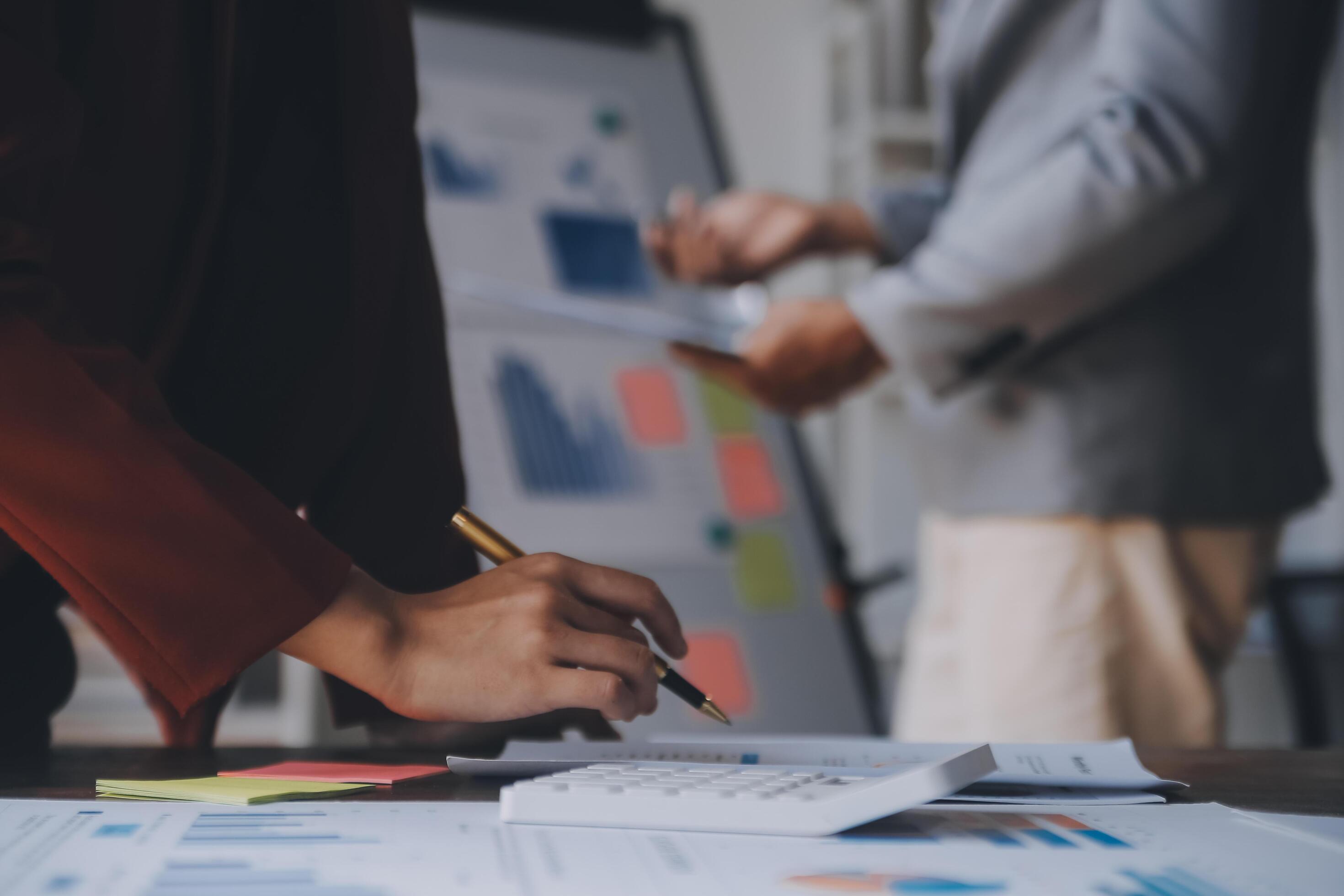 Close up of Business team analyzing income charts and graphs with modern laptop computer. Business analysis and strategy concept. Stock Free