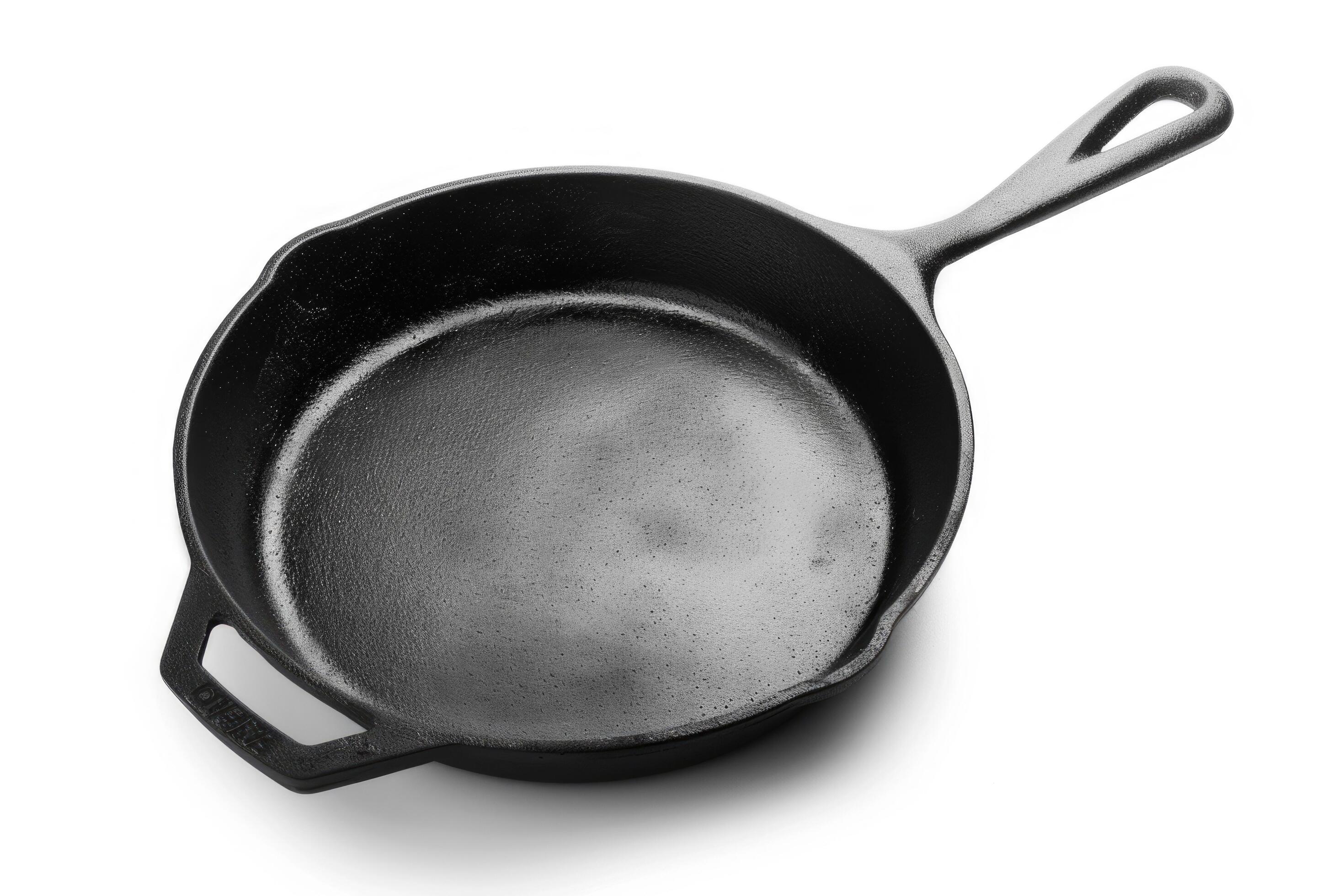 
									Black cast iron skillet on a white background. Stock Free