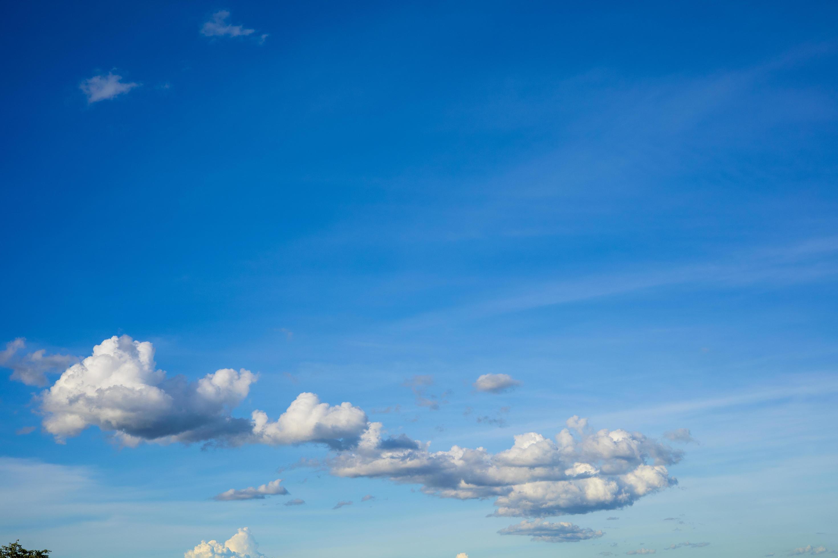 Beautiful bright blue sky with white clouds, nature background concept. Stock Free