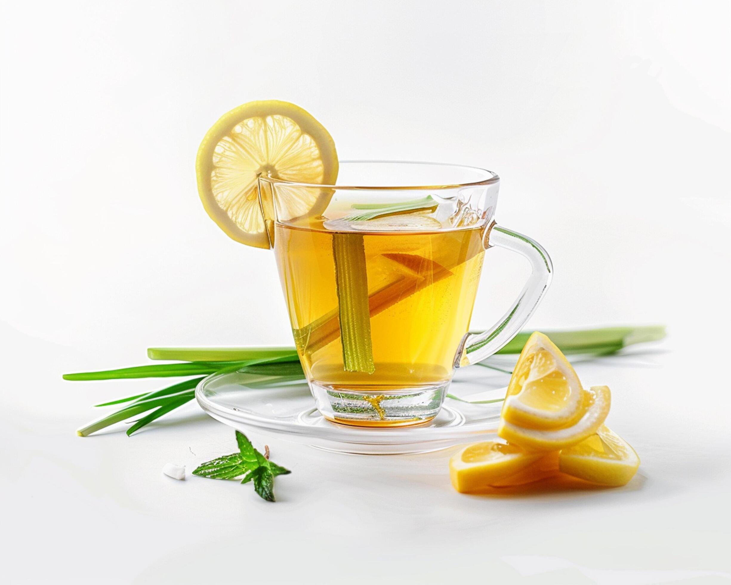 a glass cup with lemon slices and a leaf Stock Free