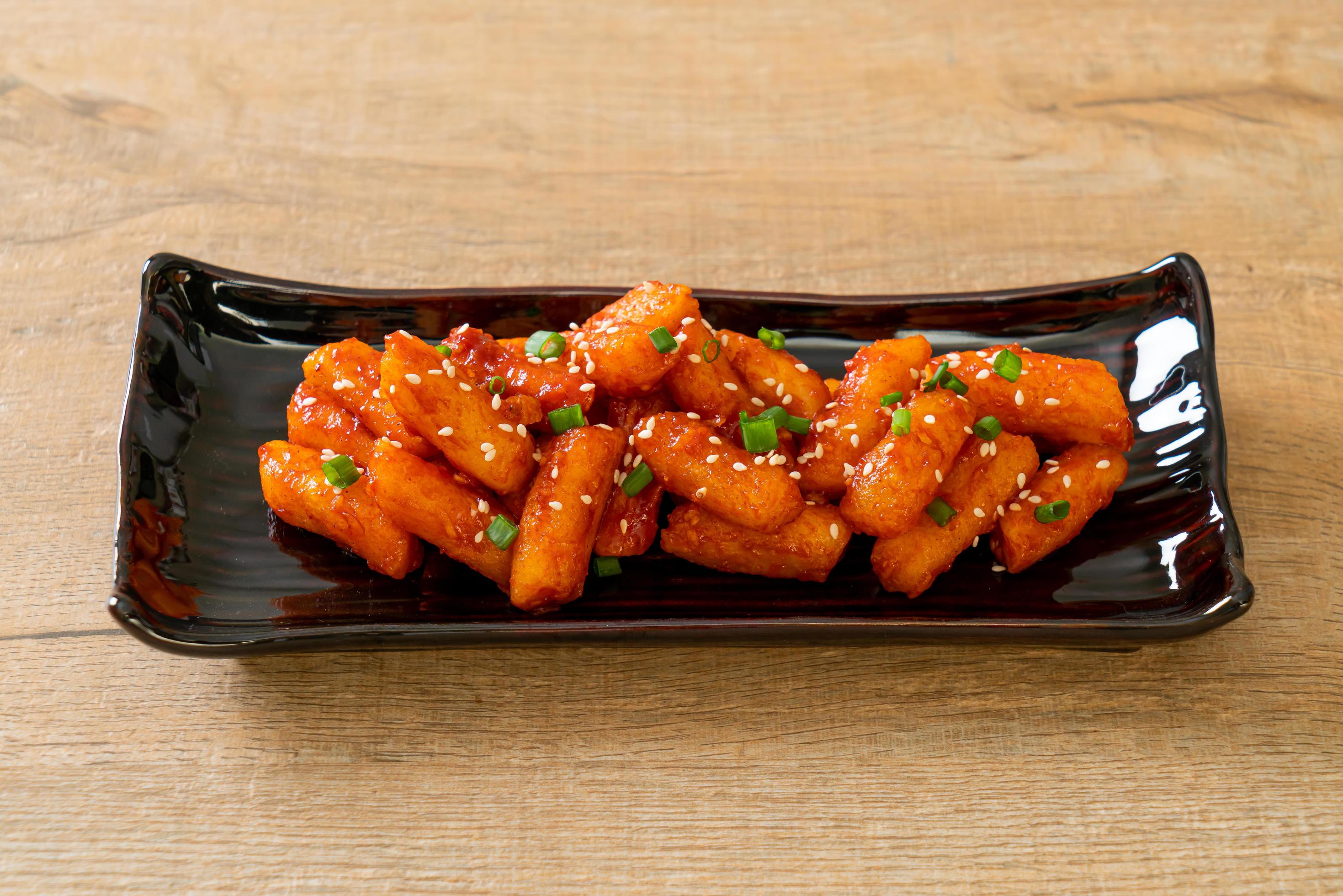 Deep-fried Korean rice cake, or Tteokbokki, skewered with spicy sauce – Korean food style Stock Free