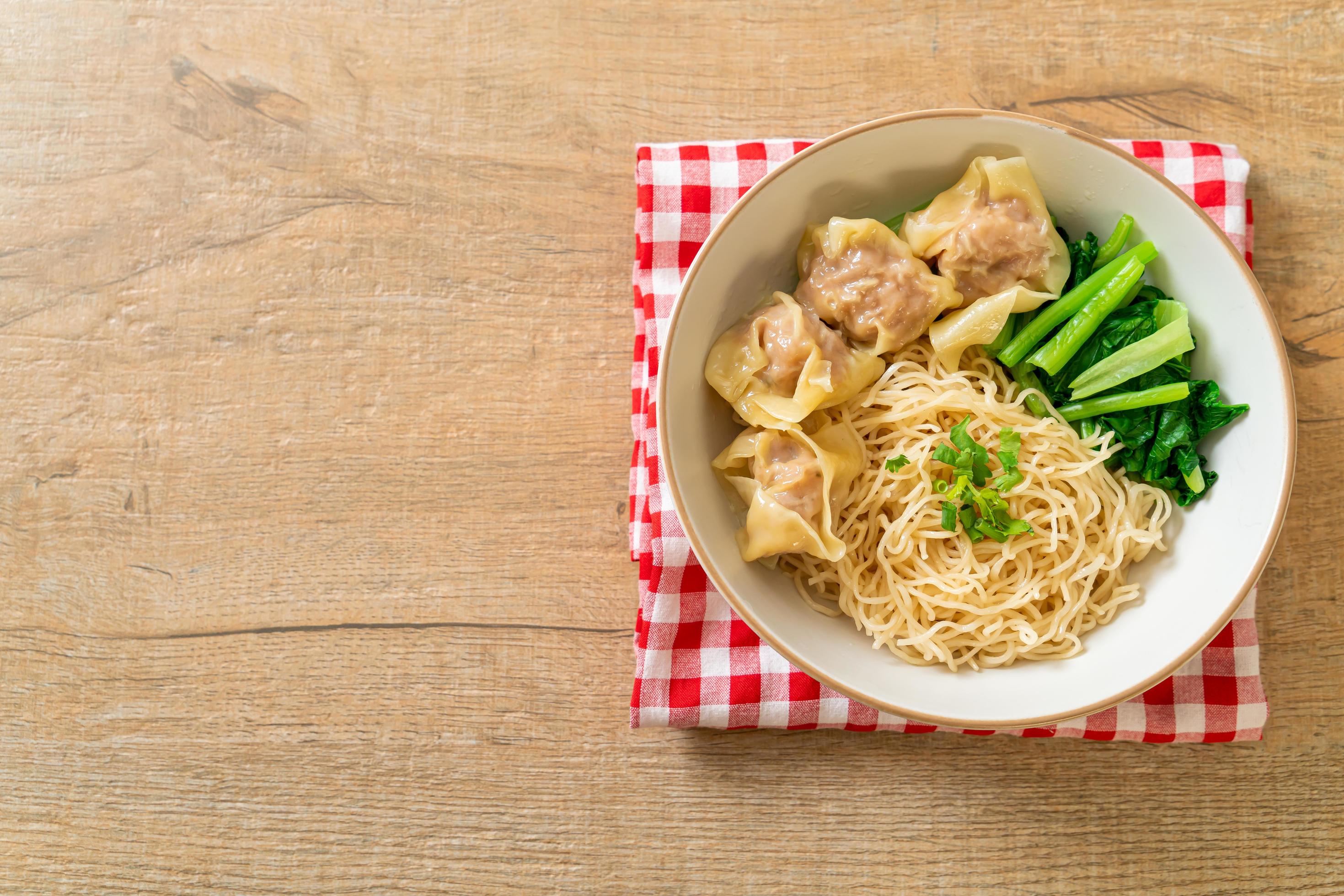 Dried egg noodles with pork wonton or pork dumplings without soup Asian food style Stock Free