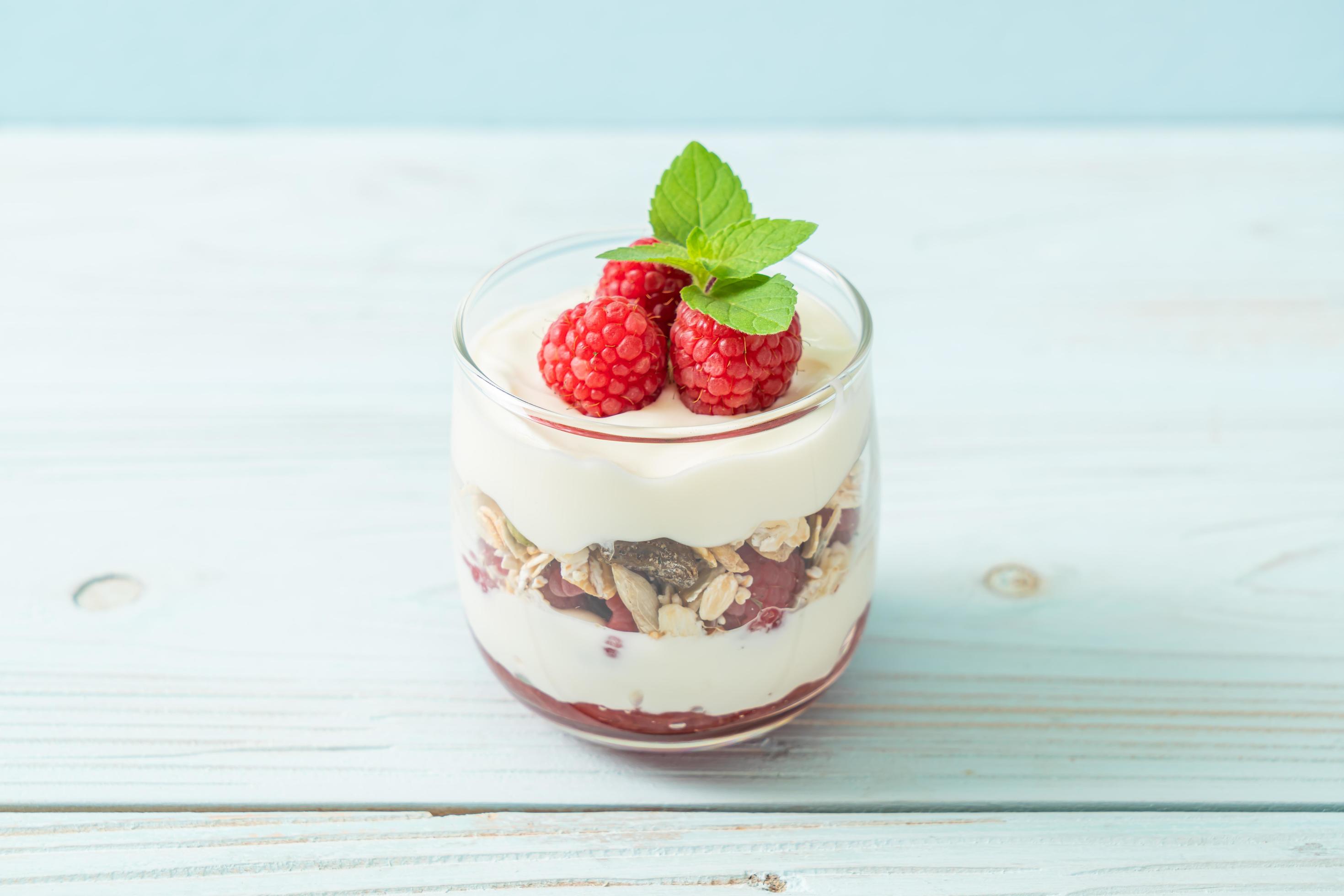 Fresh raspberry and yogurt with granola – Healthy food style Stock Free