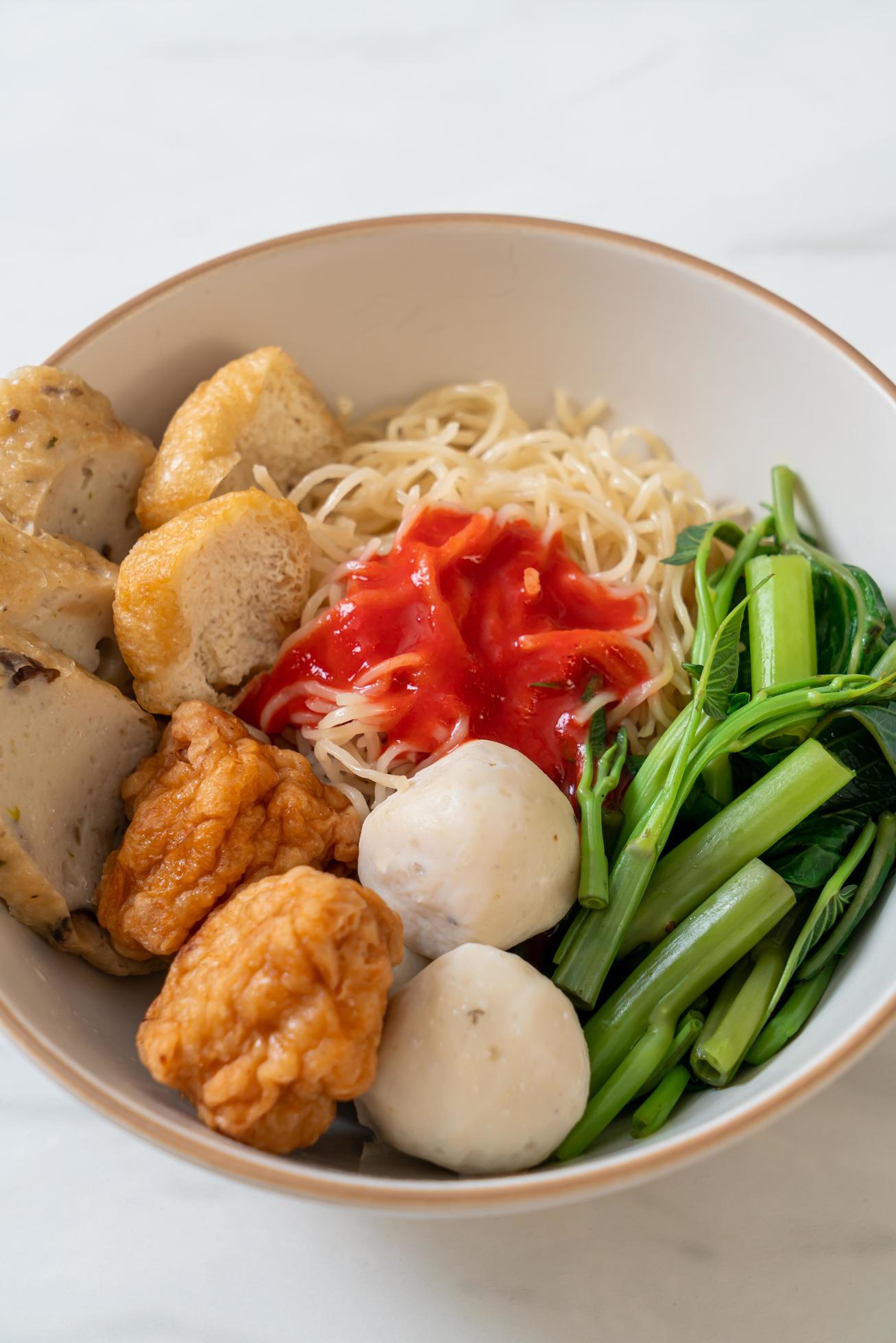 Egg noodles with fish balls and shrimp balls in pink sauce, Yen Ta Four or Yen Ta Fo – Asian food style Stock Free