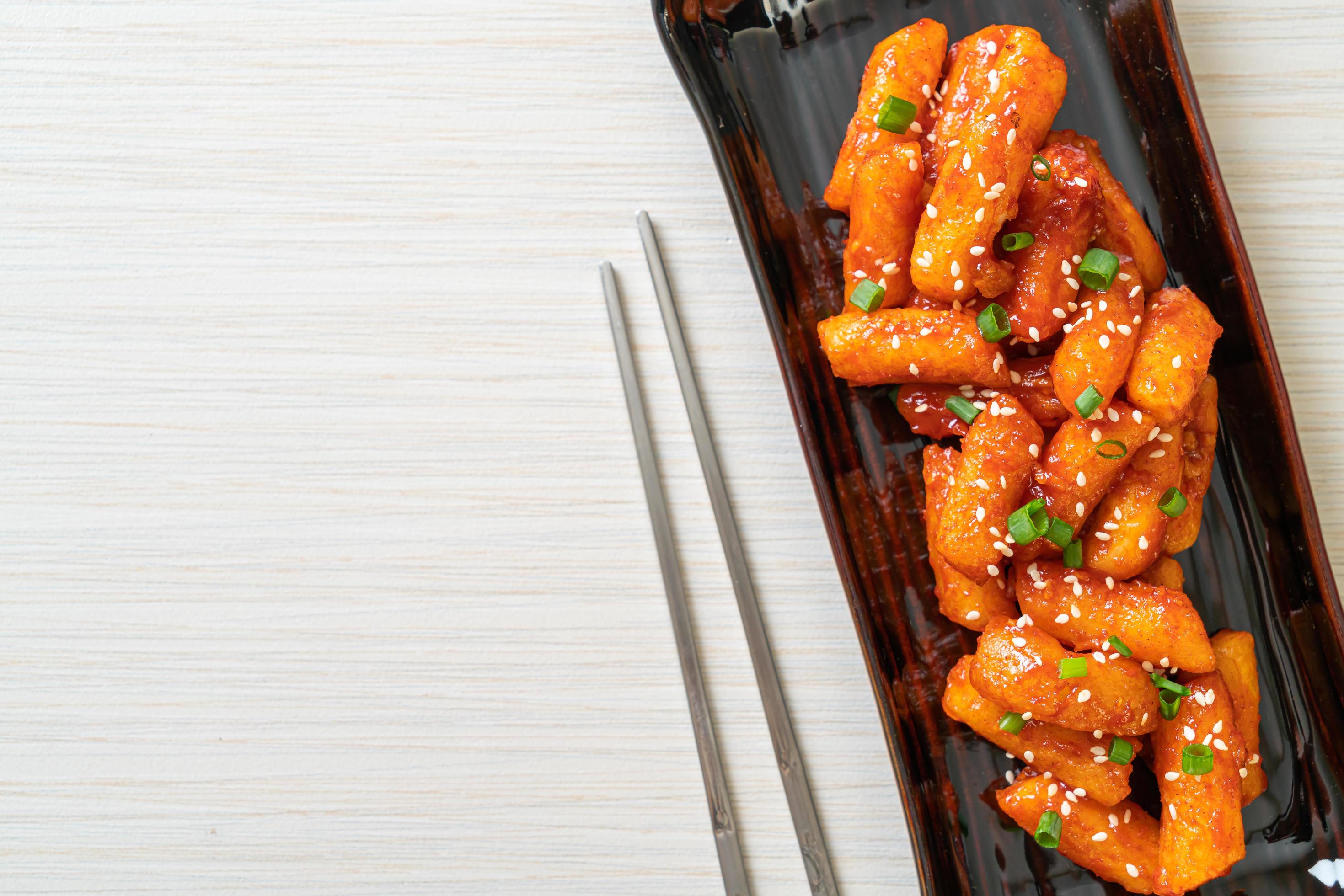 Deep-fried Korean rice cake, or Tteokbokki, skewered with spicy sauce – Korean food style Stock Free